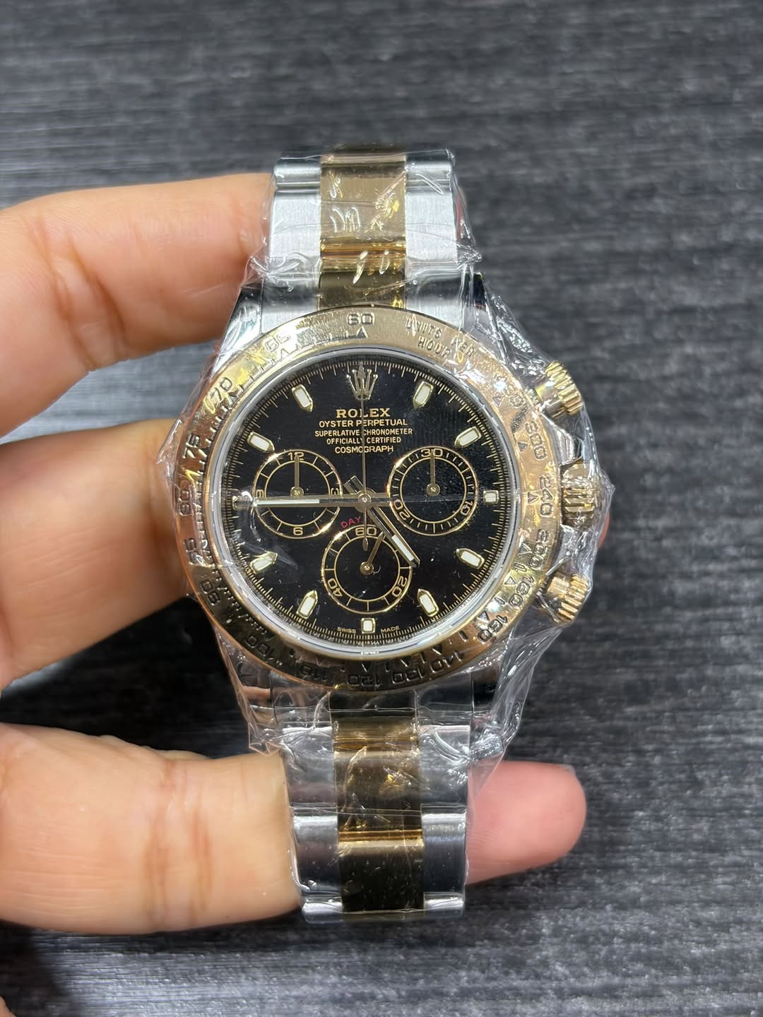 May be an image of wrist watch and text