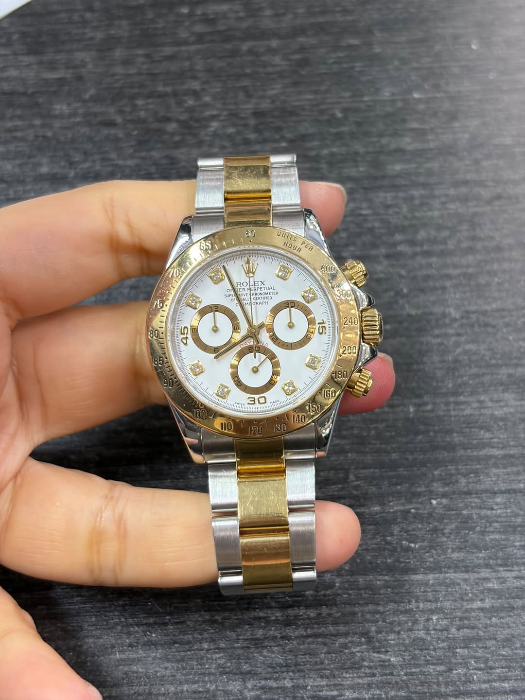 May be an image of wrist watch and text