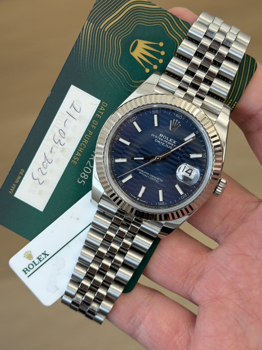 May be an image of wrist watch and text