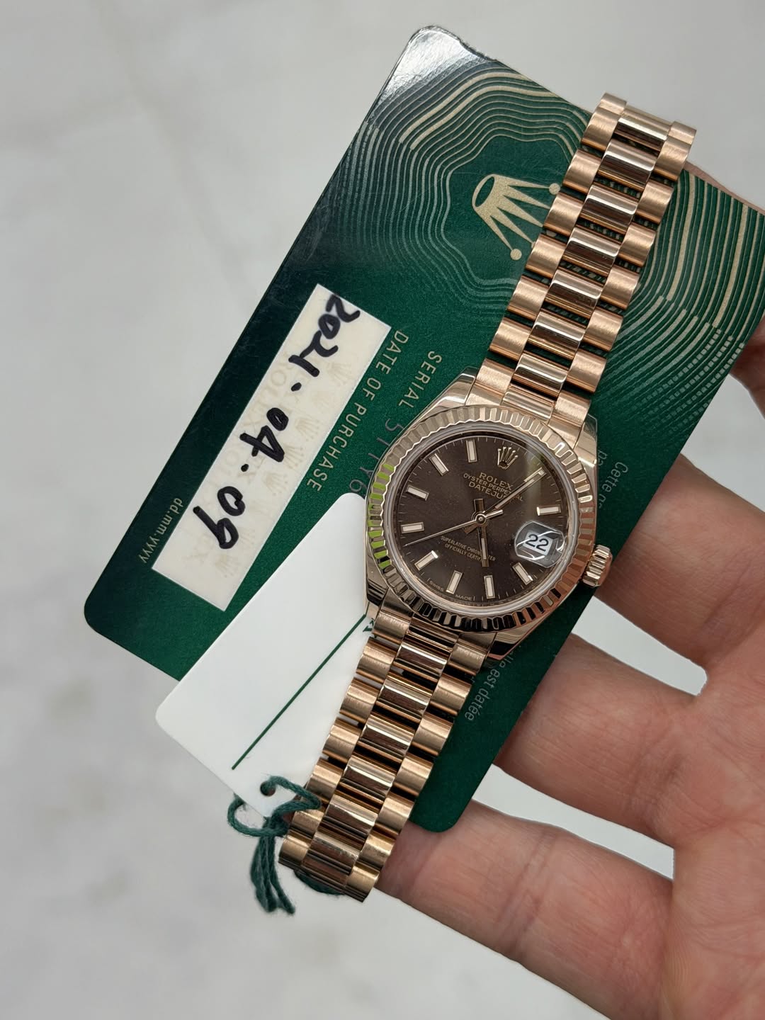 May be an image of wrist watch and text