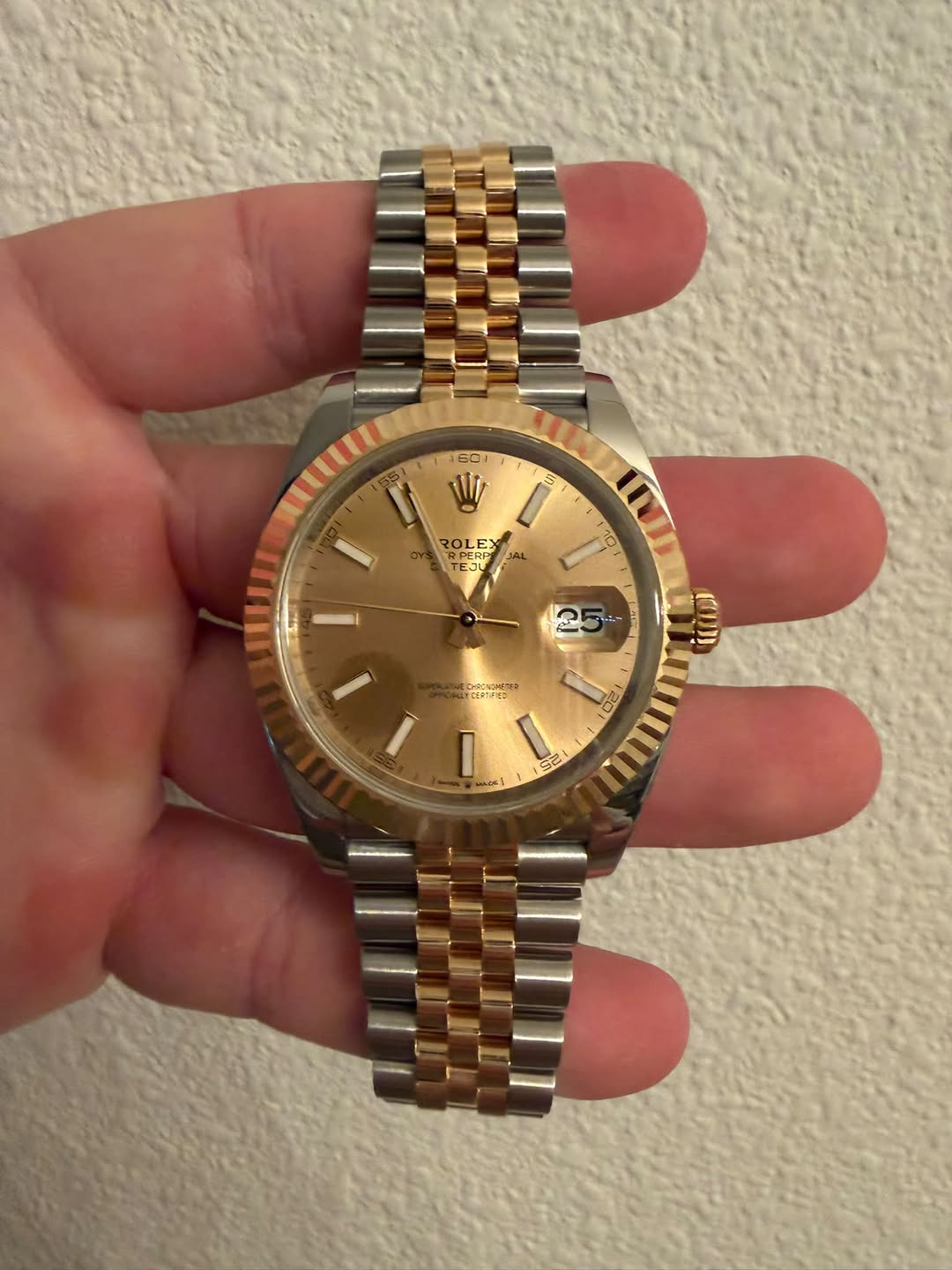May be an image of wrist watch and text