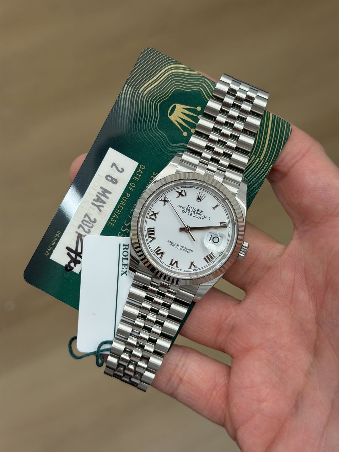 May be an image of wrist watch and text
