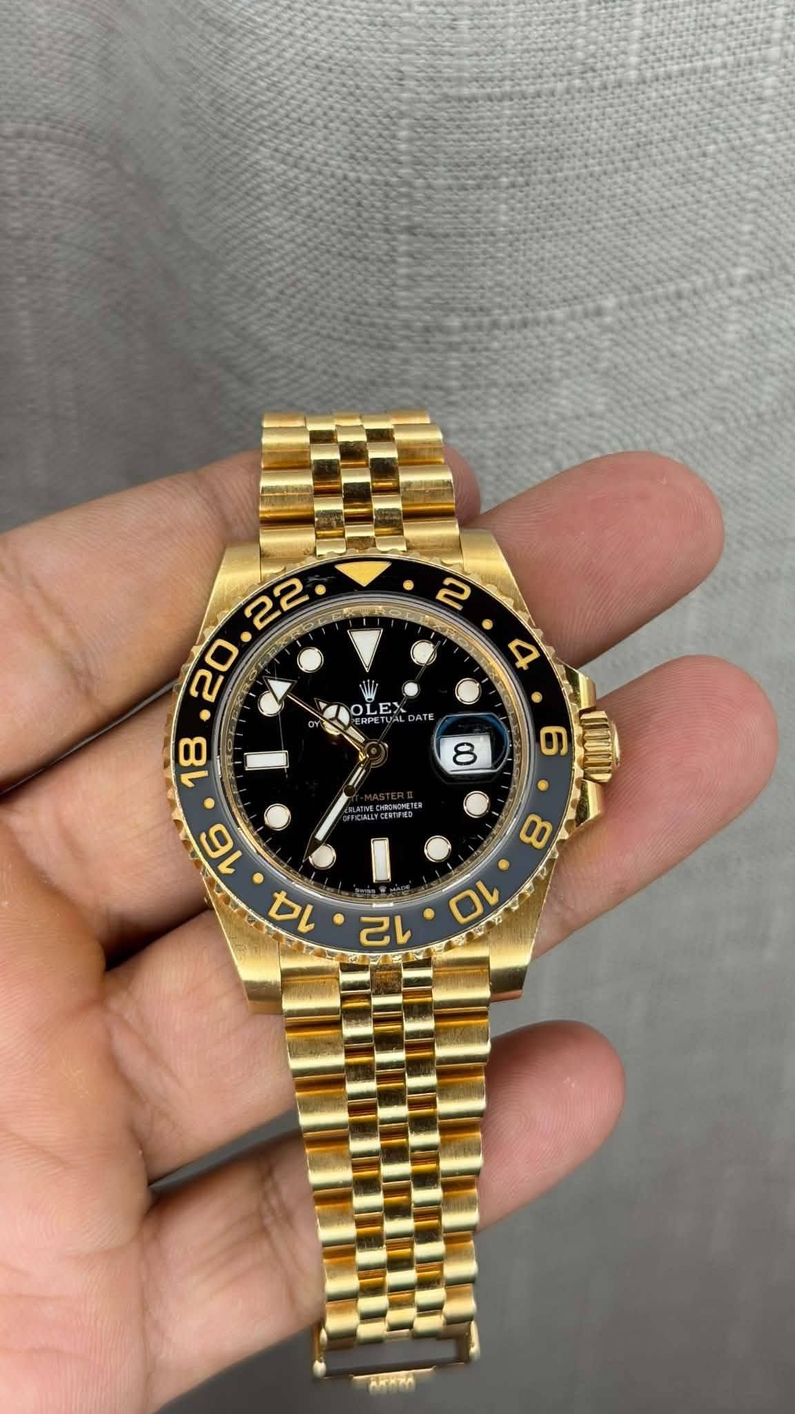 May be an image of wrist watch and text