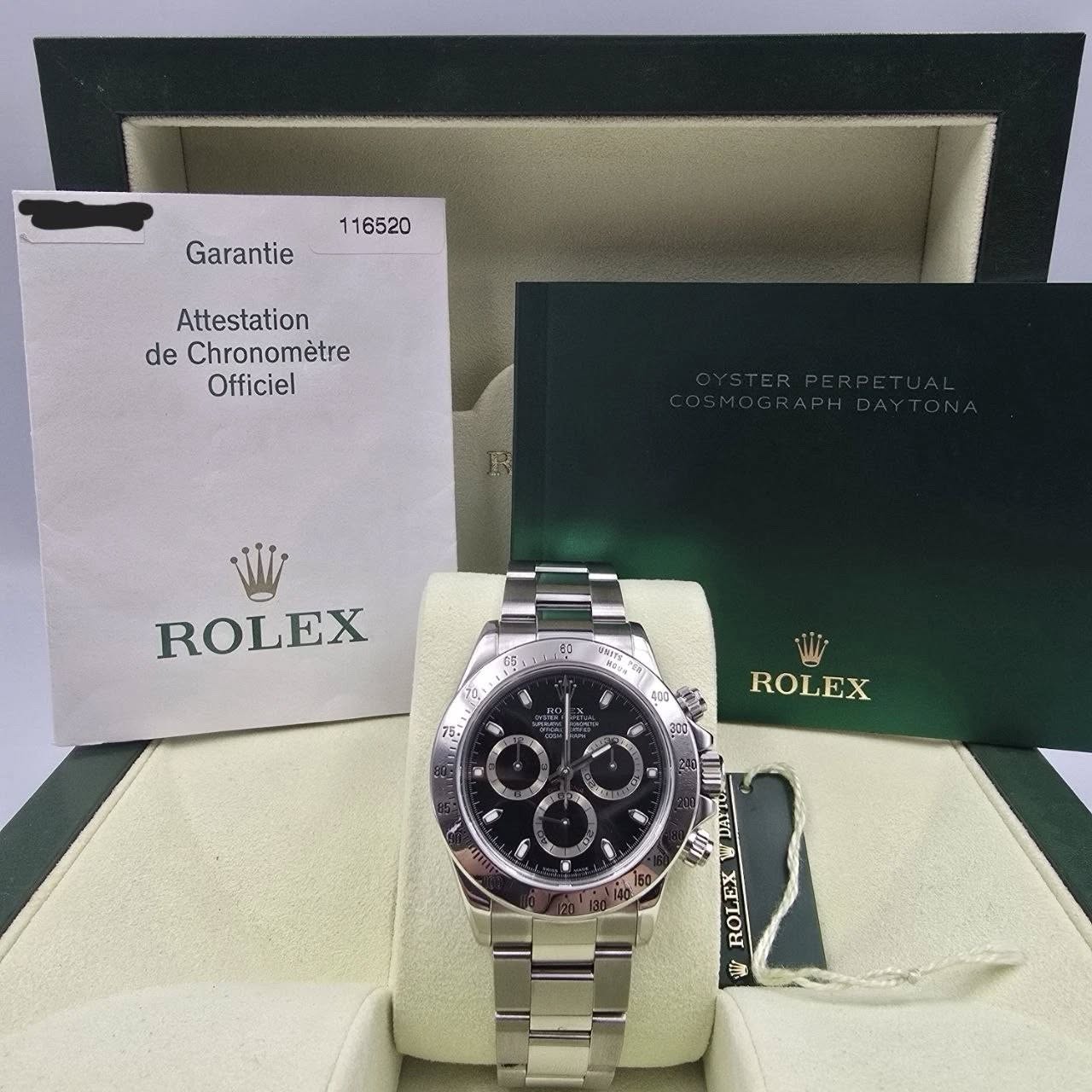 May be an image of wrist watch and text that says '116520 Garantie Attestation de Chronomètre Officiel ROLEX 60 B 0 សាងី Hи ROLEX F သ กลยก በ XOLOX 愚'