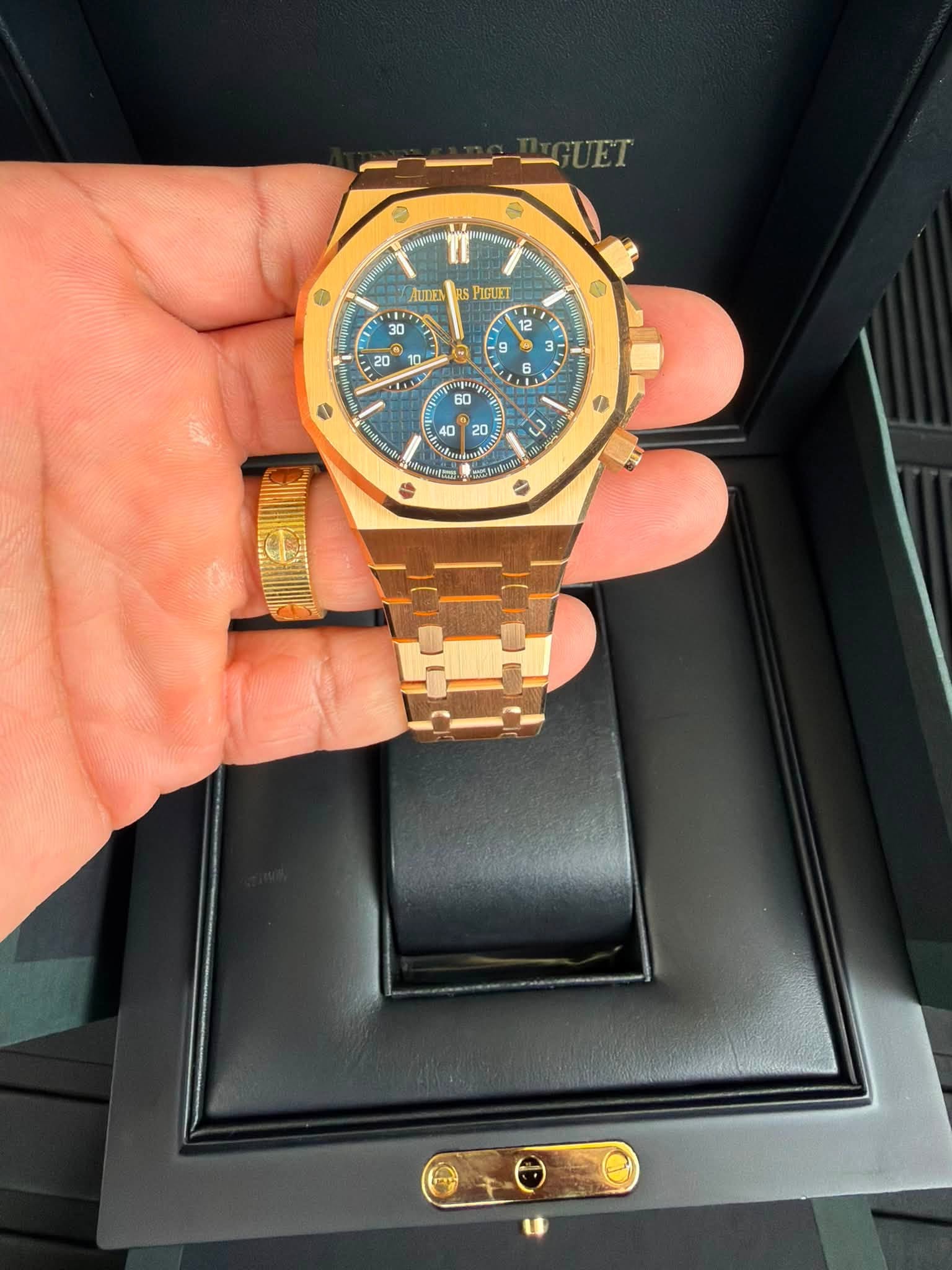 May be an image of wrist watch and text