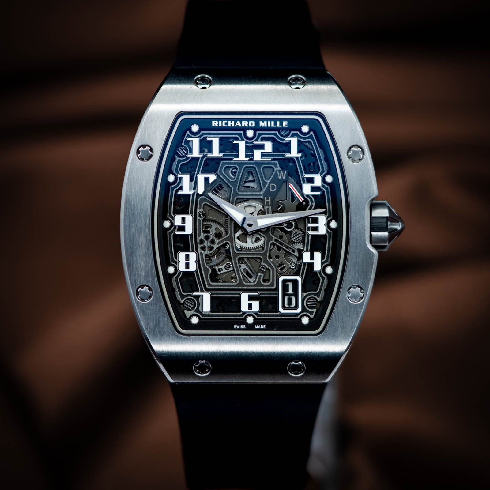 May be an image of wrist watch and text that says 'RICHARD RICHARDMILLE MILLE 11 11121 የለም W 2 L 4 B 9 8 SWSS MADE'