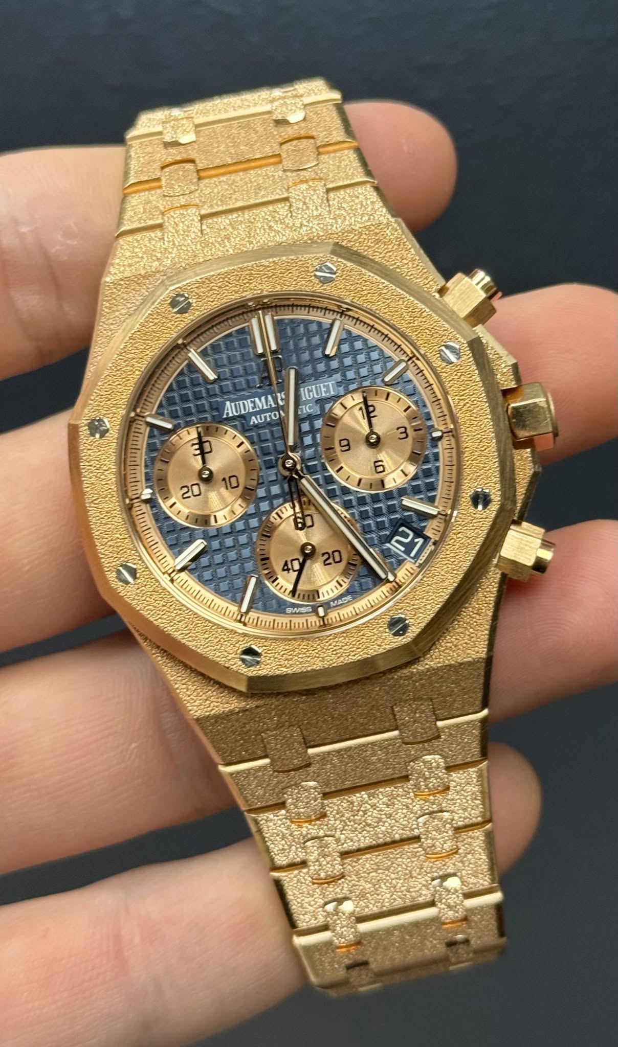 May be an image of wrist watch and text