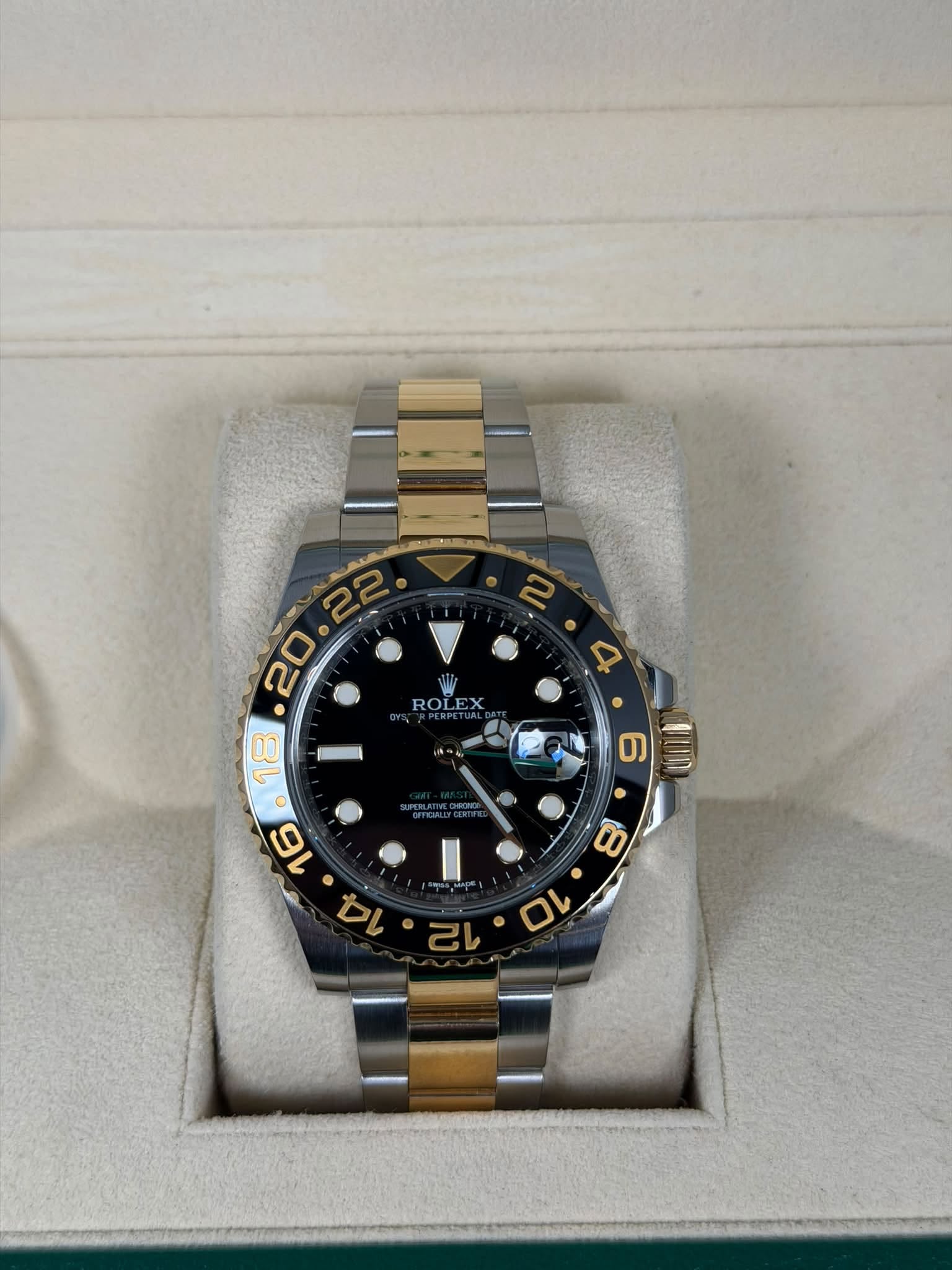 May be an image of wrist watch and text