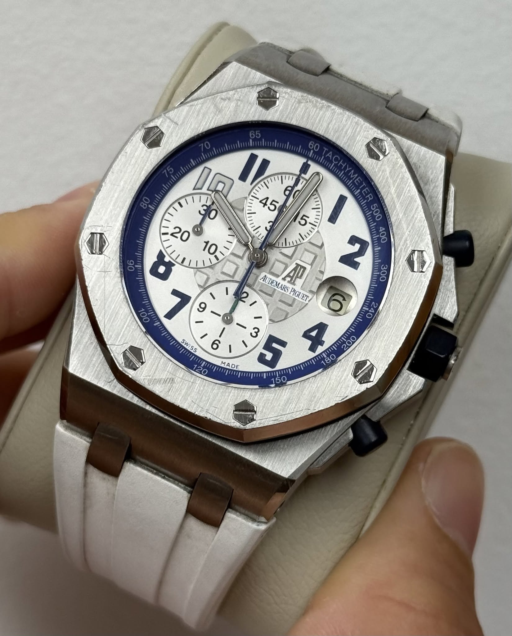 May be an image of wrist watch and text