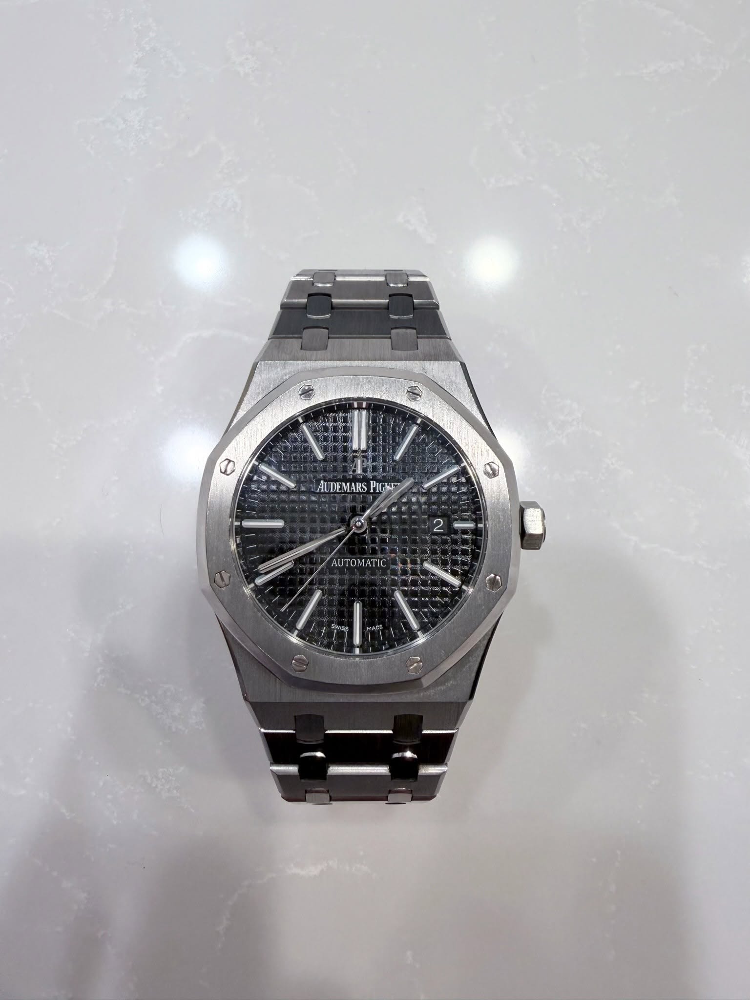 May be an image of wrist watch and text
