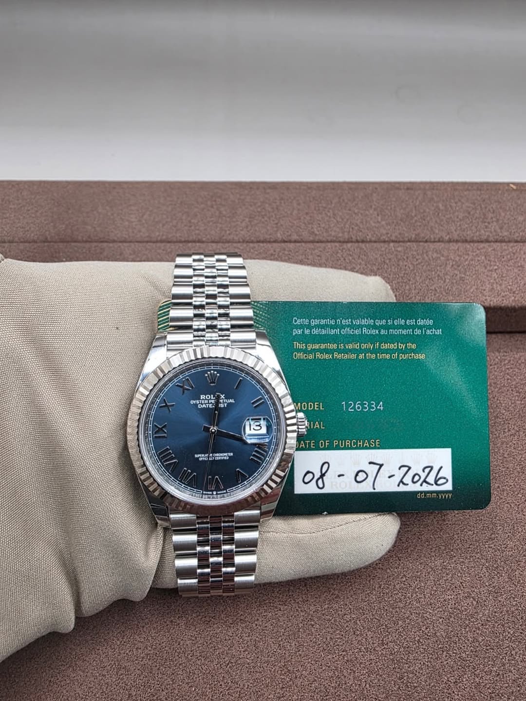 May be an image of wrist watch and text