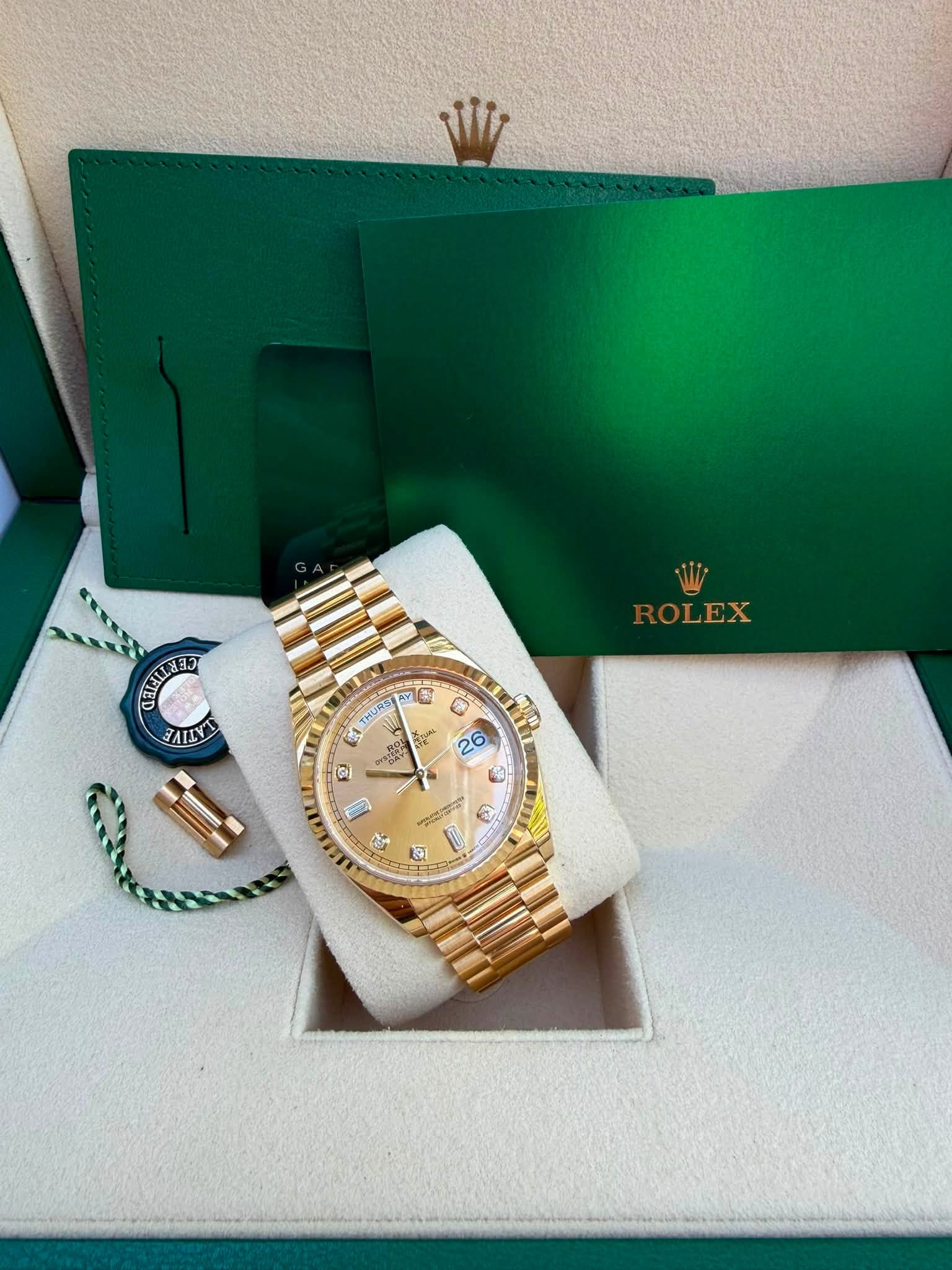 May be an image of wrist watch and text