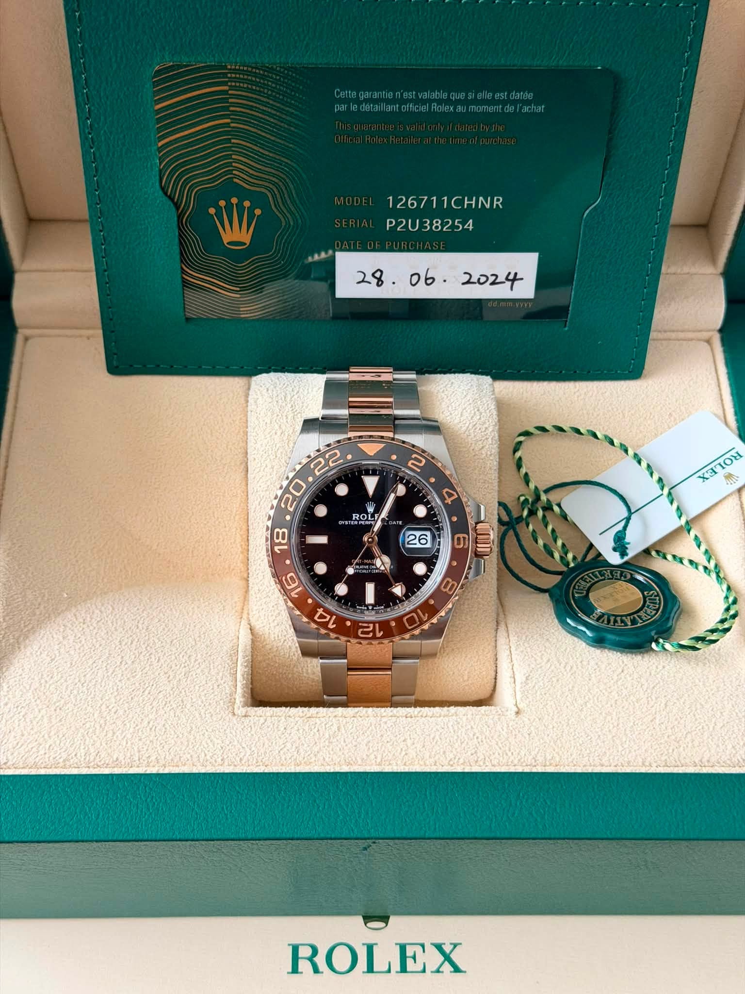 May be an image of wrist watch and text that says '1267 126711CHNR HNR P2U38254 ROLI OL e mI 10 8 12 ROLEX'