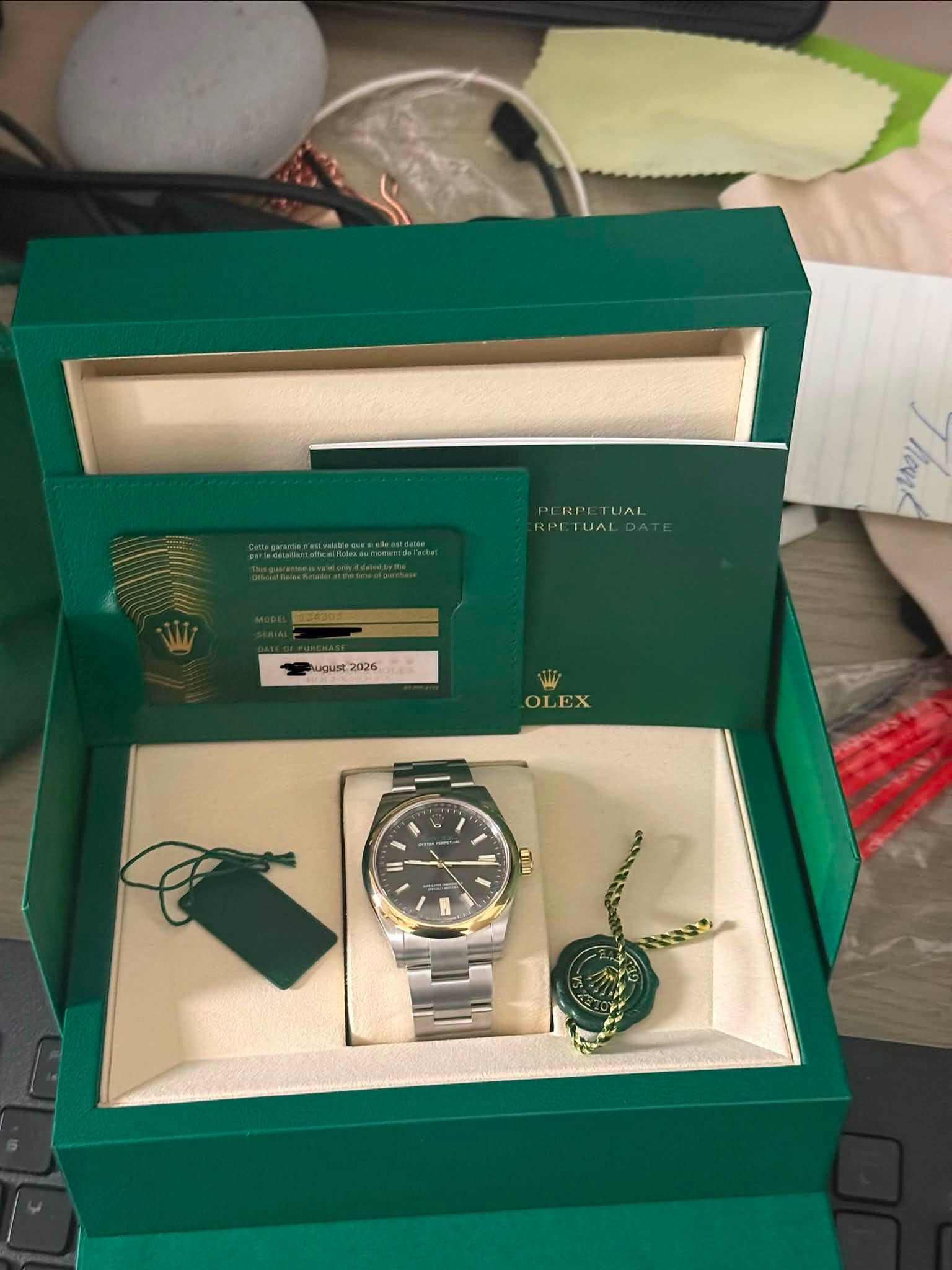 May be an image of wrist watch and text that says 'PERPI PERPETUAI RPE LA PE ETUAL august2026 2026 OLEX مدا'