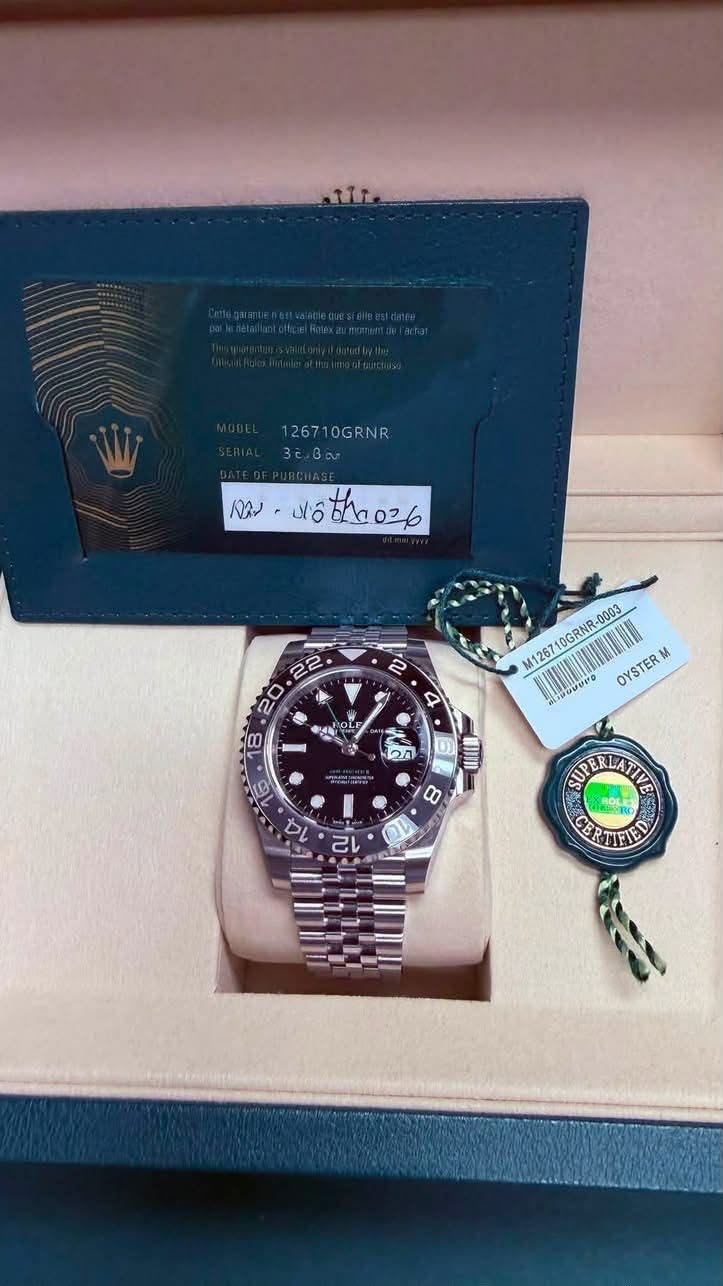 May be an image of wrist watch and text