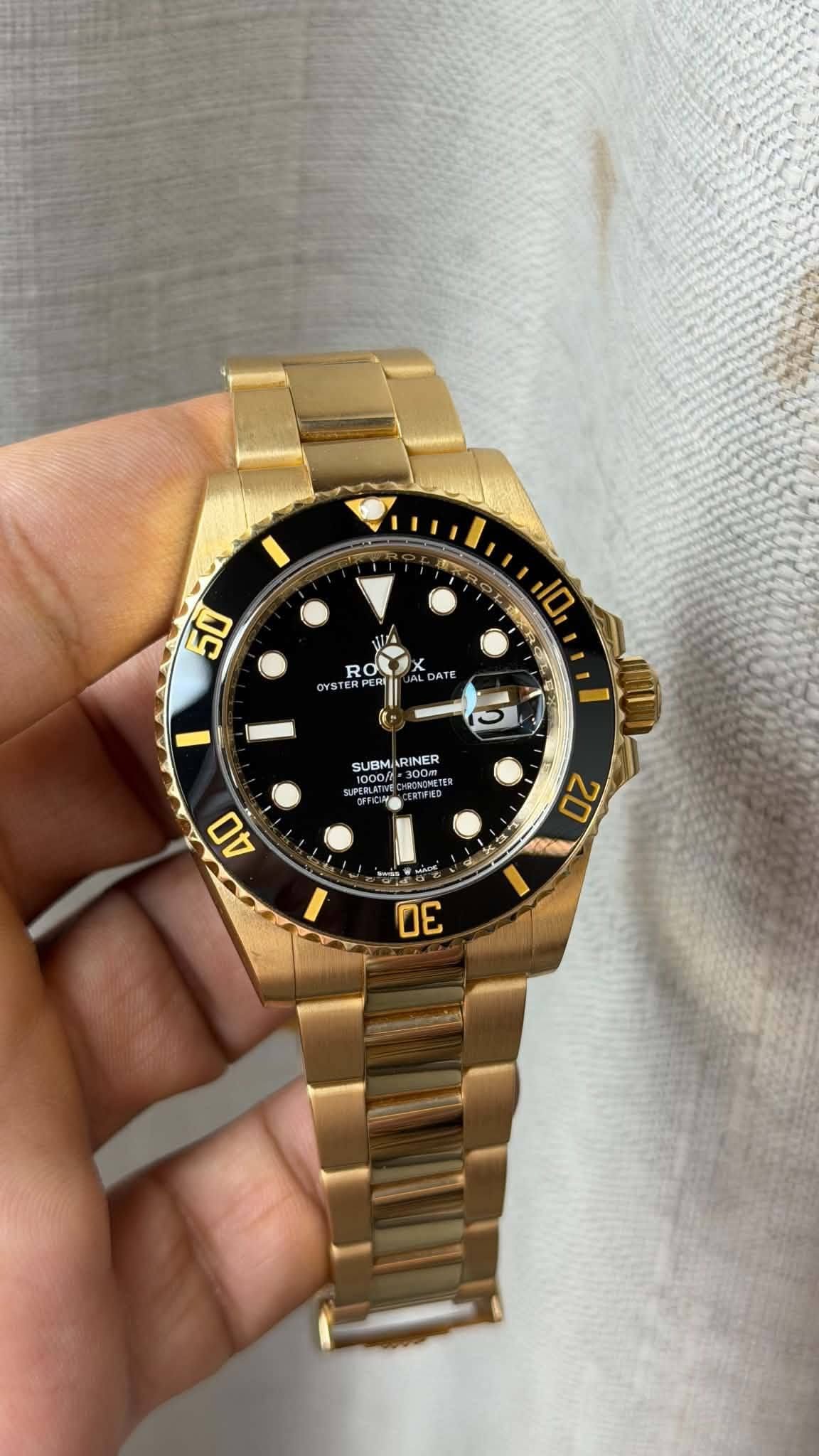 May be an image of wrist watch and text