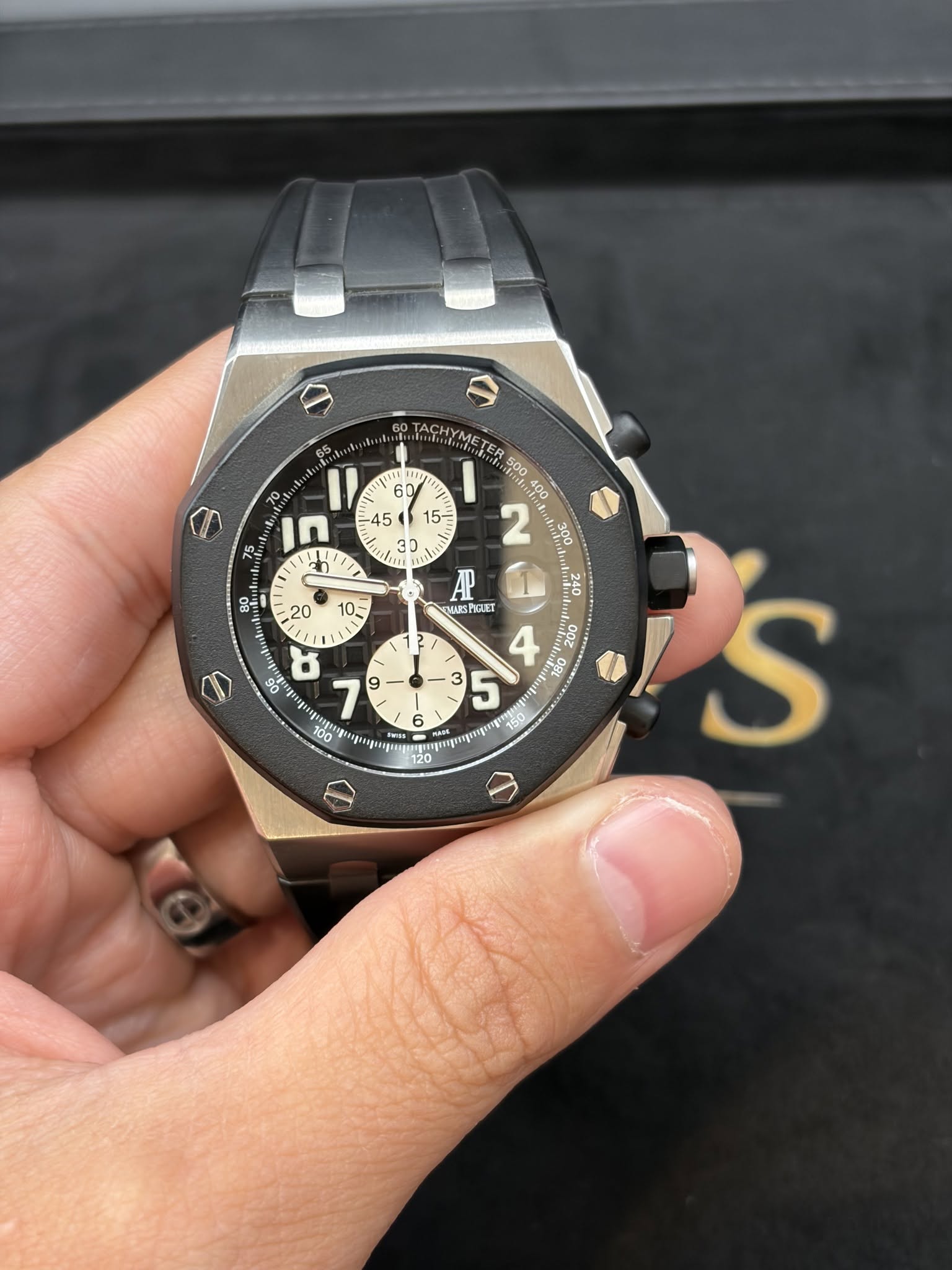 May be an image of wrist watch and text