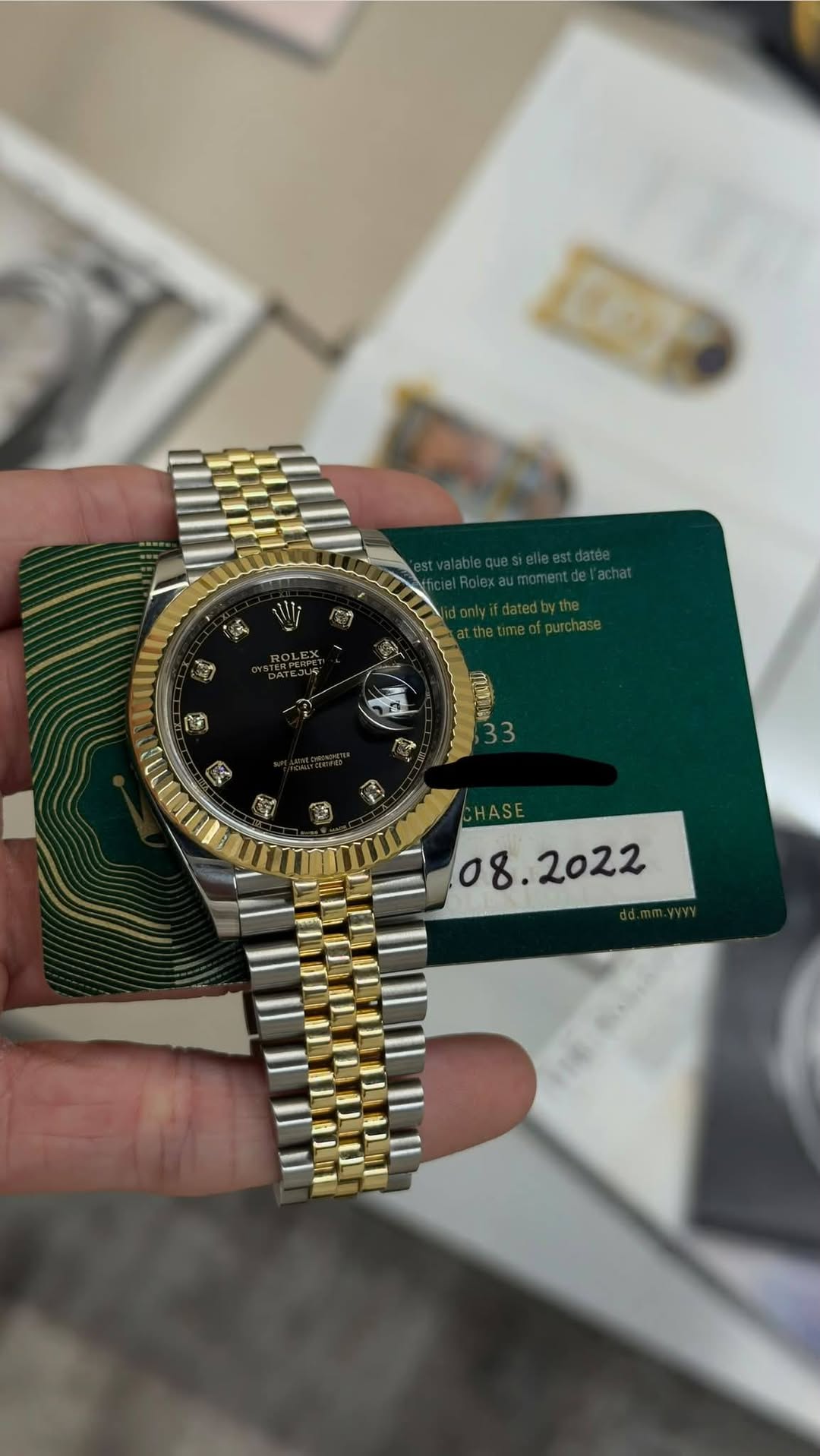 May be an image of wrist watch and text