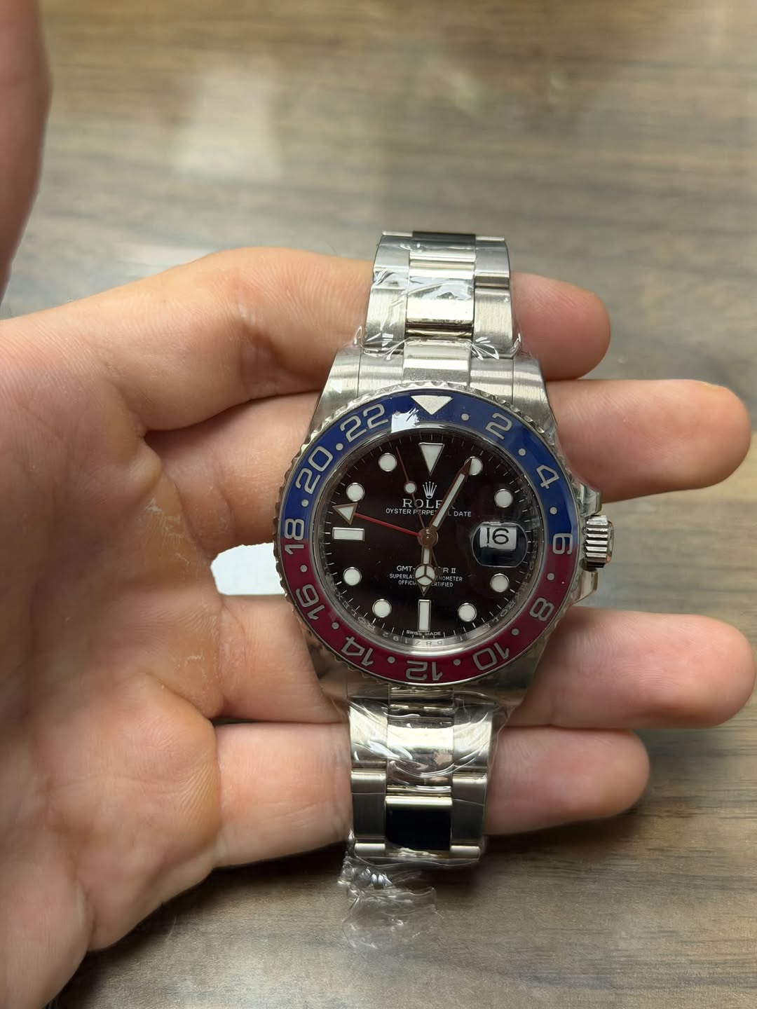 May be an image of wrist watch and text