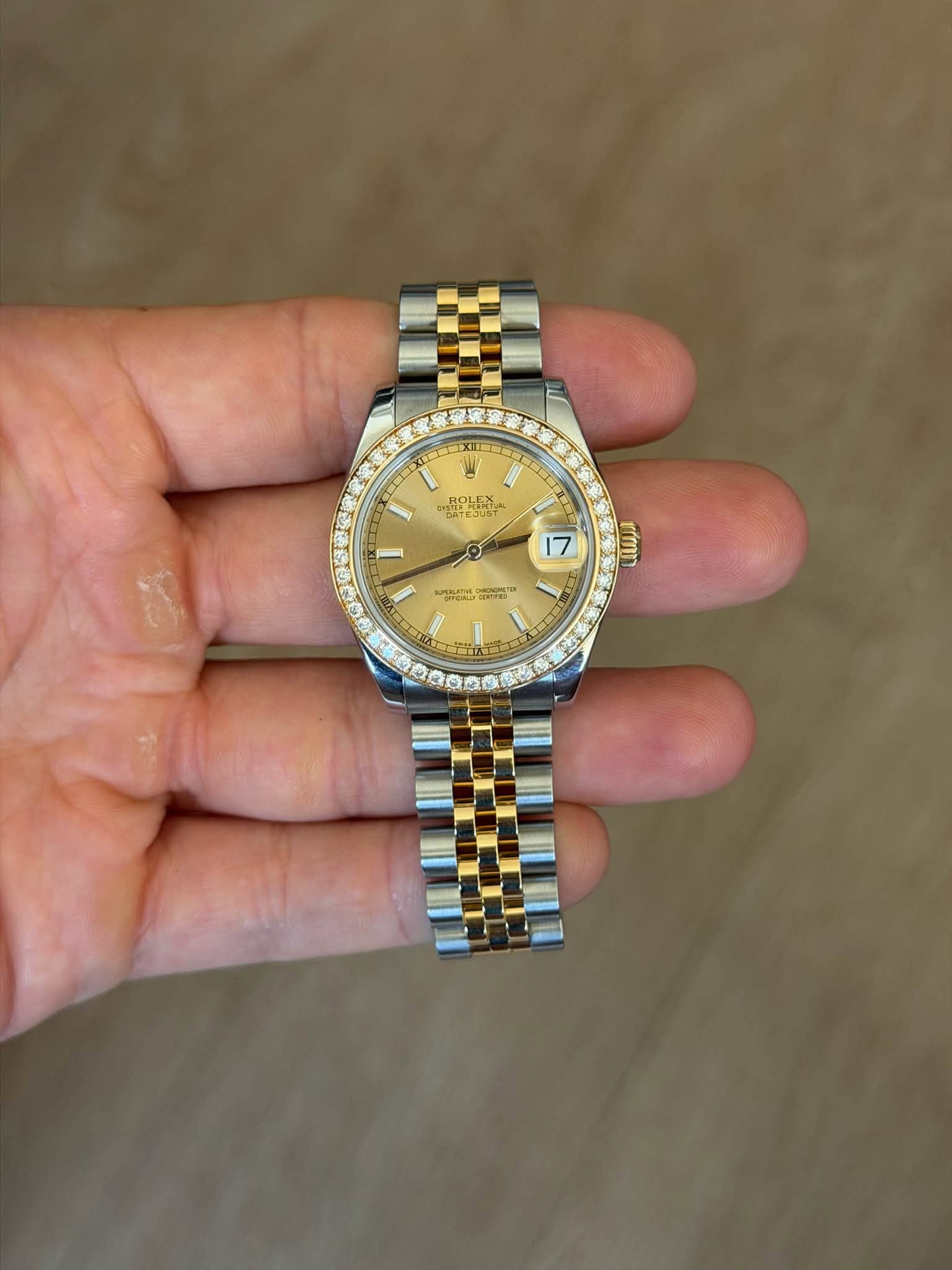 May be an image of wrist watch and text