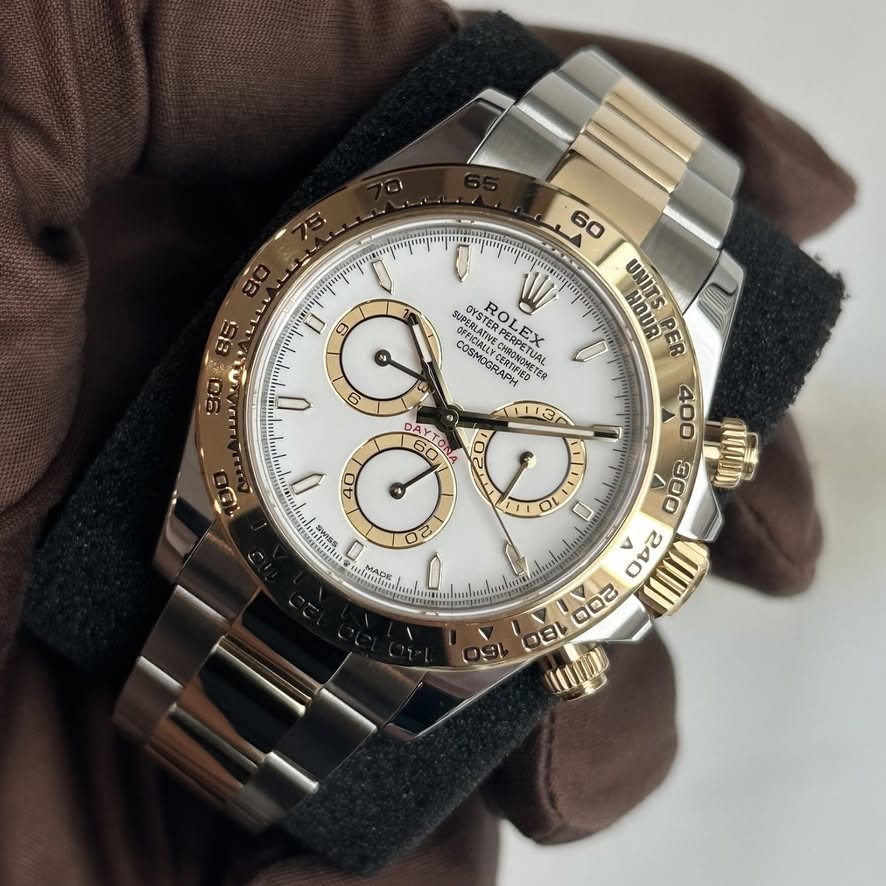 May be an image of wrist watch and text