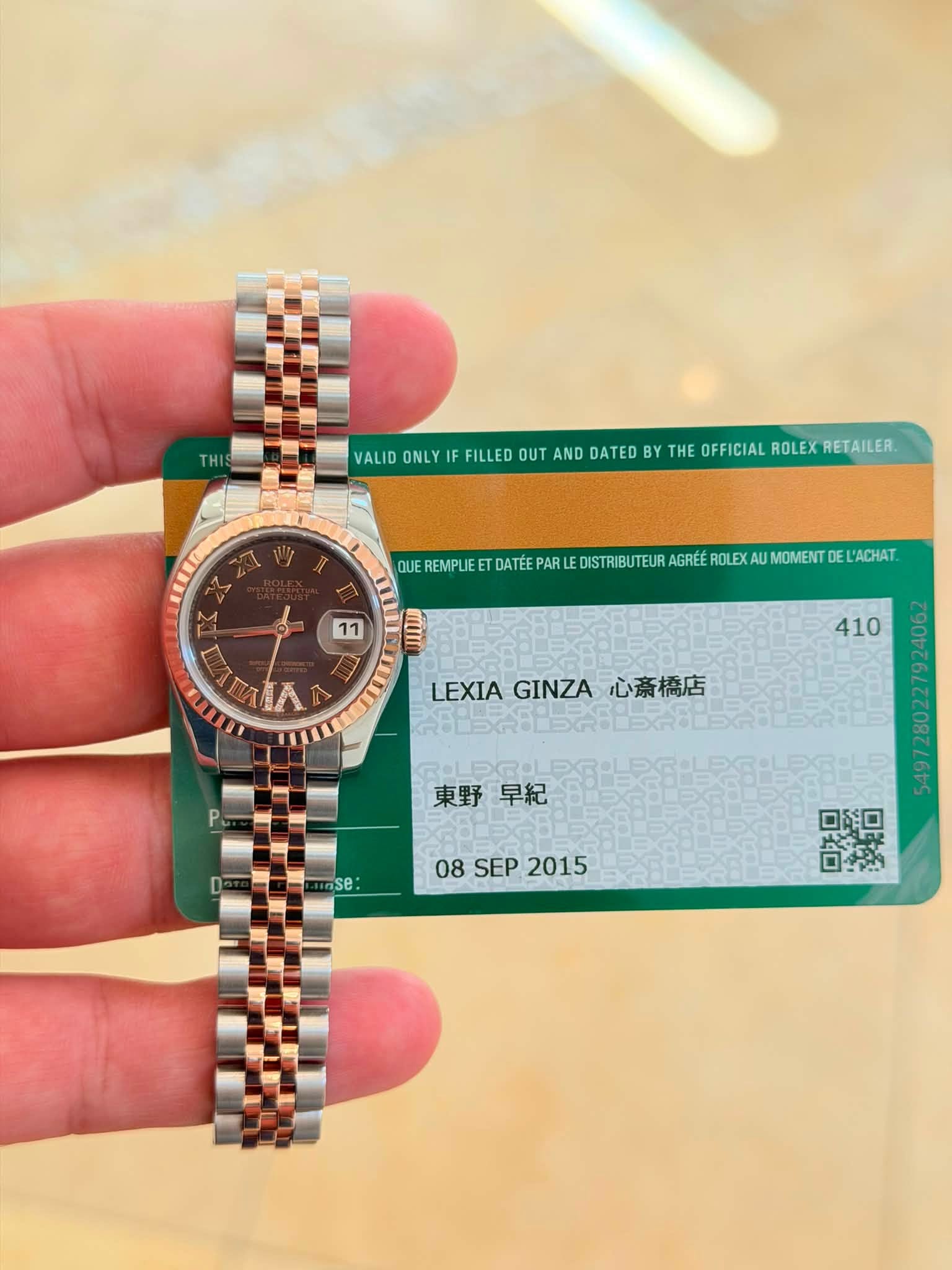 May be an image of wrist watch and text