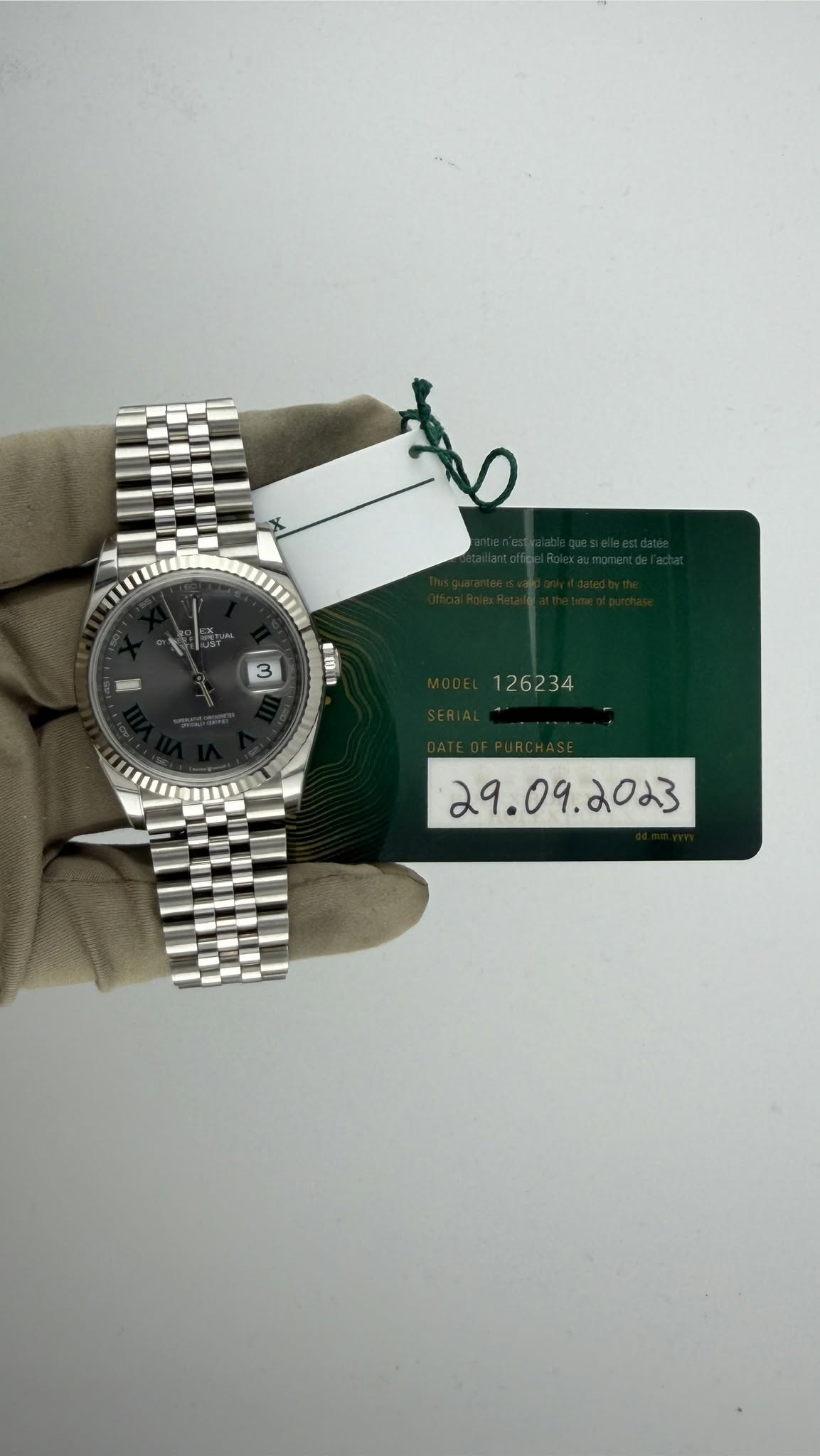 May be an image of wrist watch and text