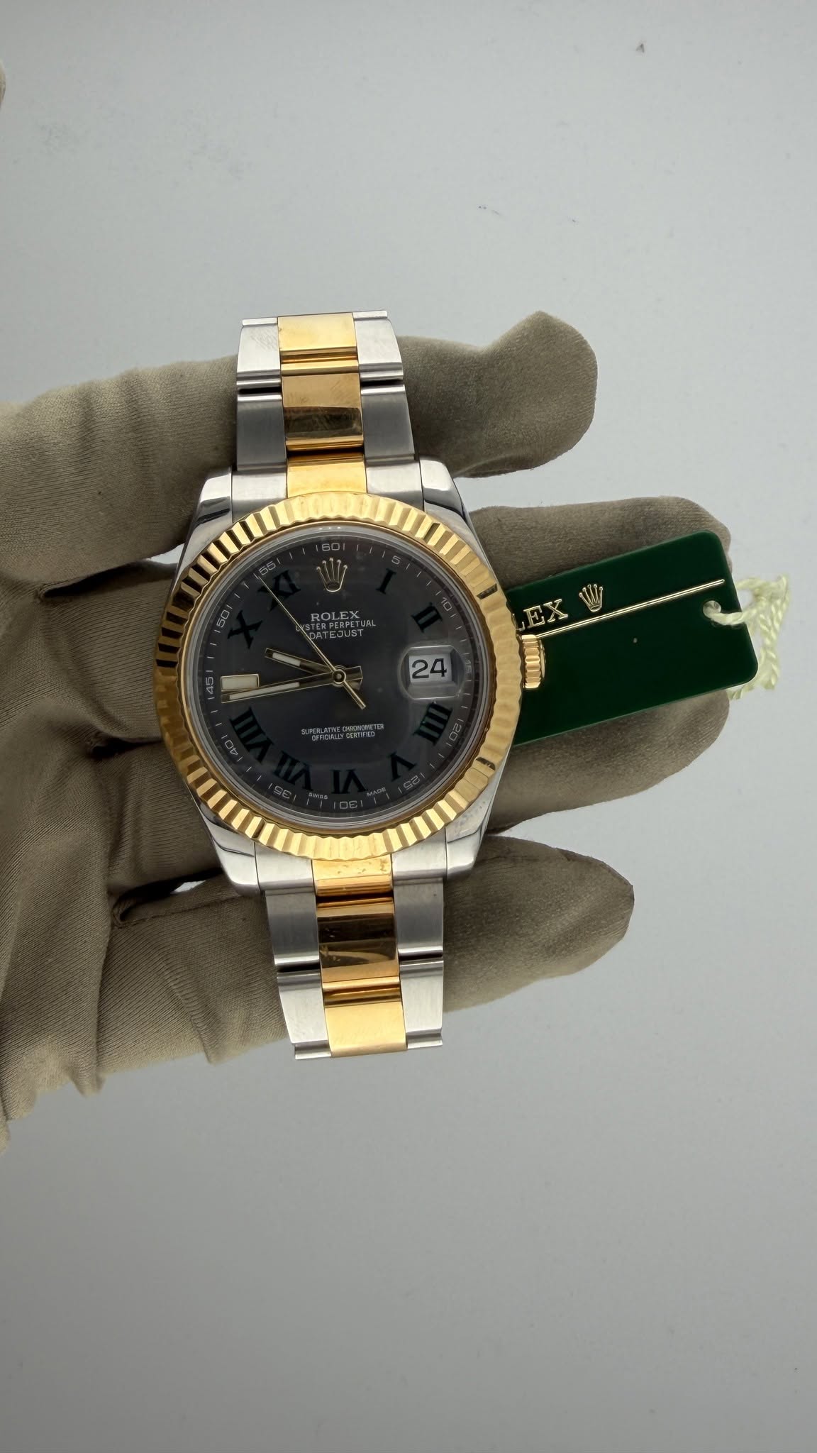 May be an image of wrist watch and text