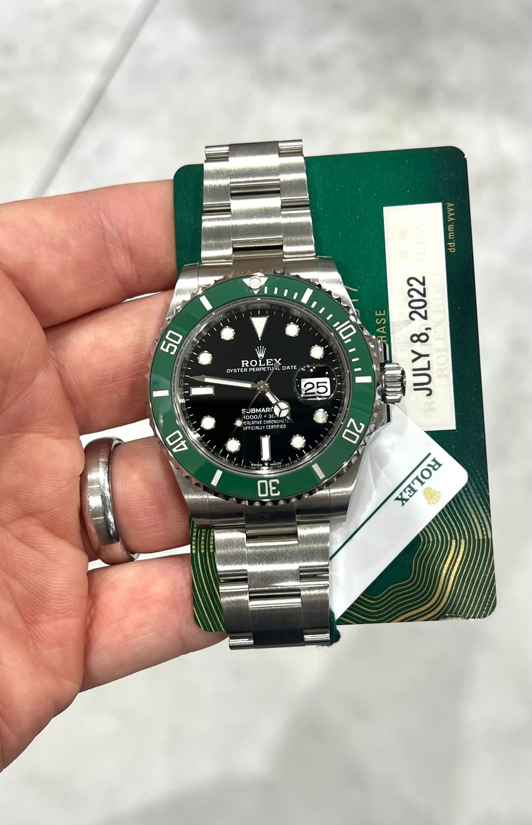 May be an image of wrist watch and text