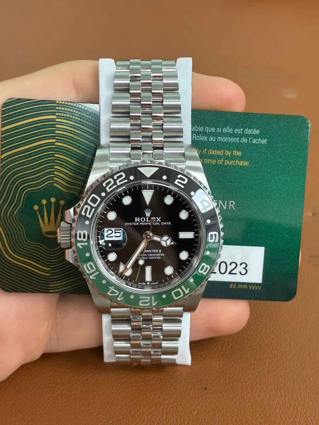 May be an image of wrist watch and text