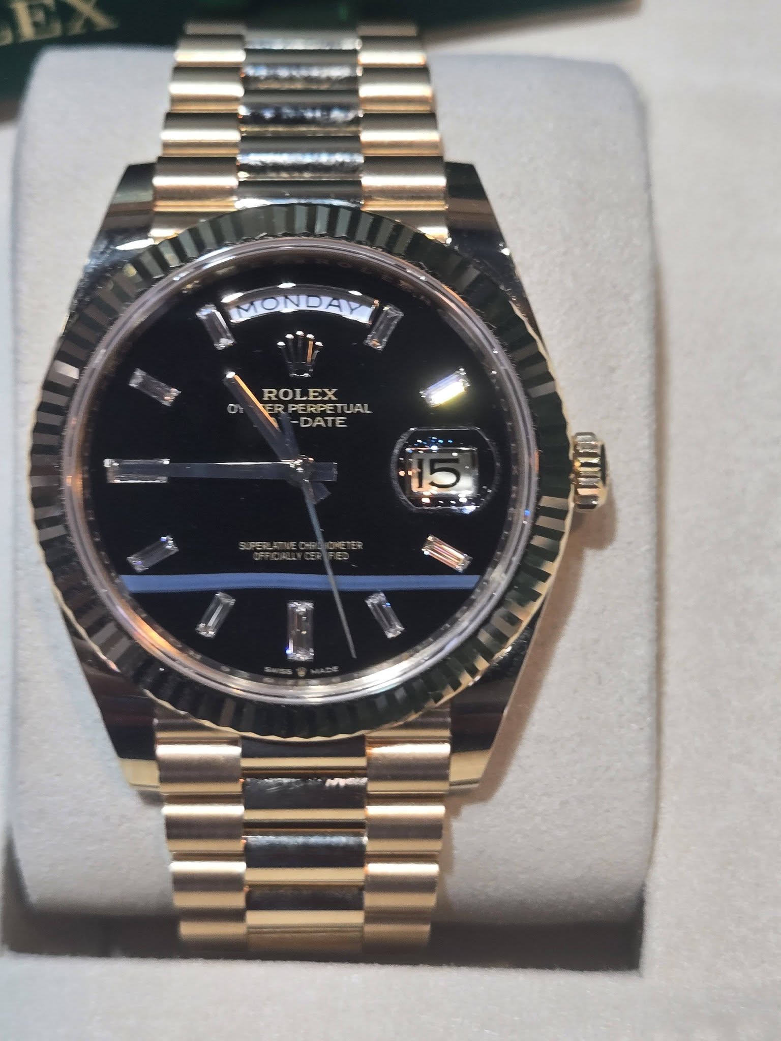 May be an image of wrist watch and text