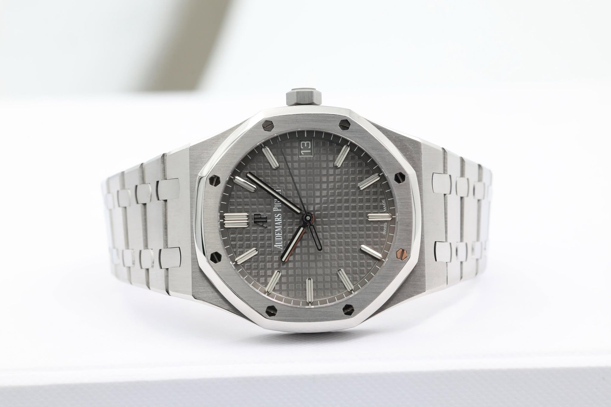 May be an image of wrist watch and text that says '13 PIC AUDEMARS'