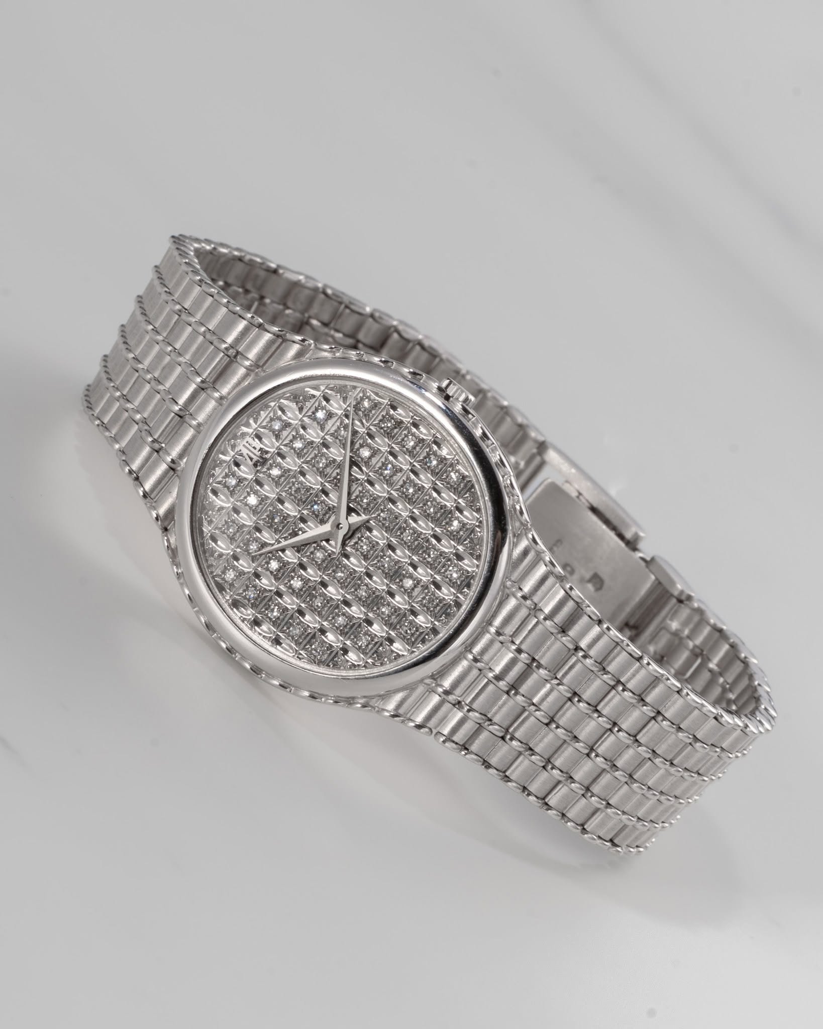 May be an image of wrist watch and jewelry