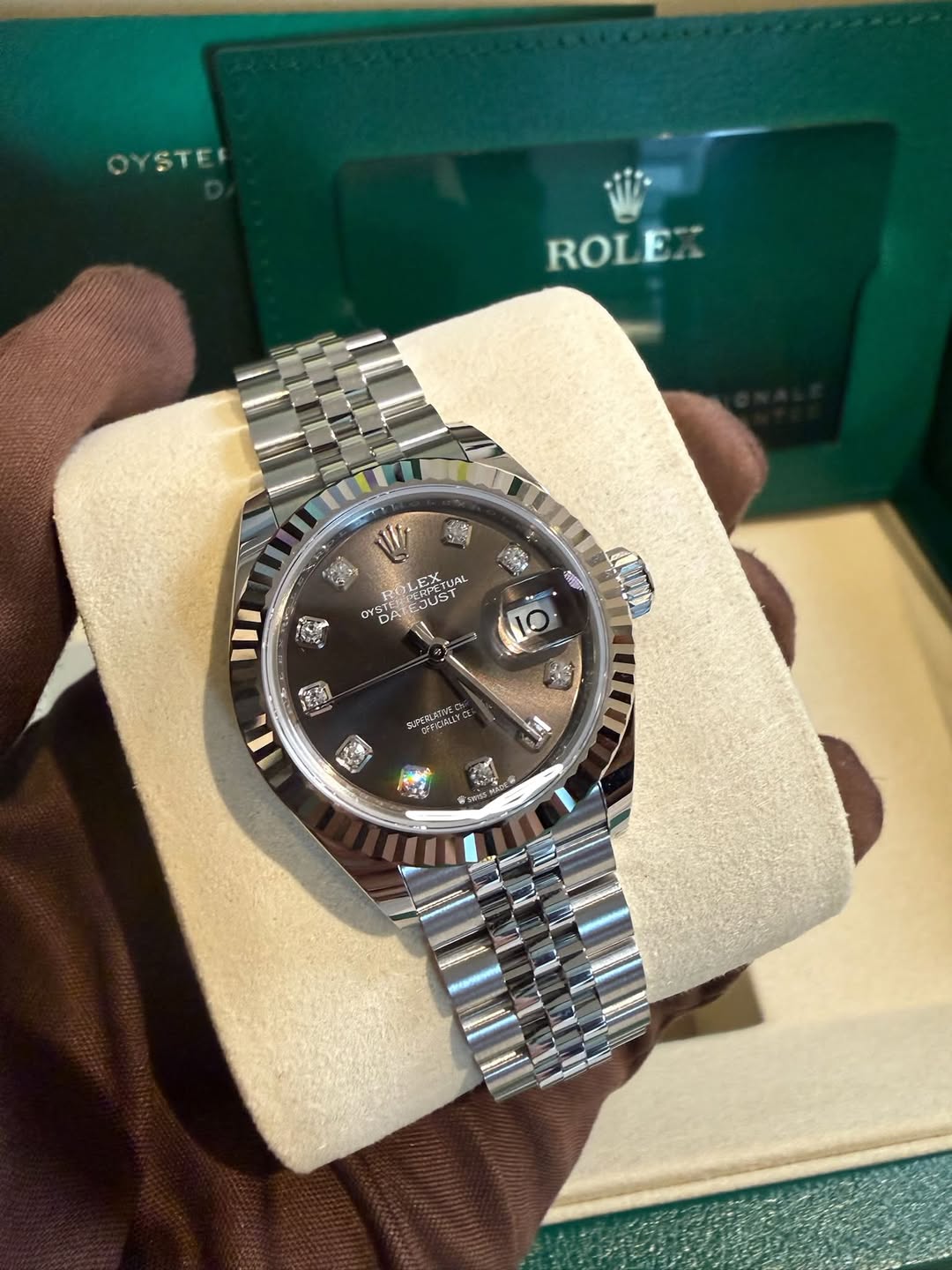 May be an image of wrist watch and text