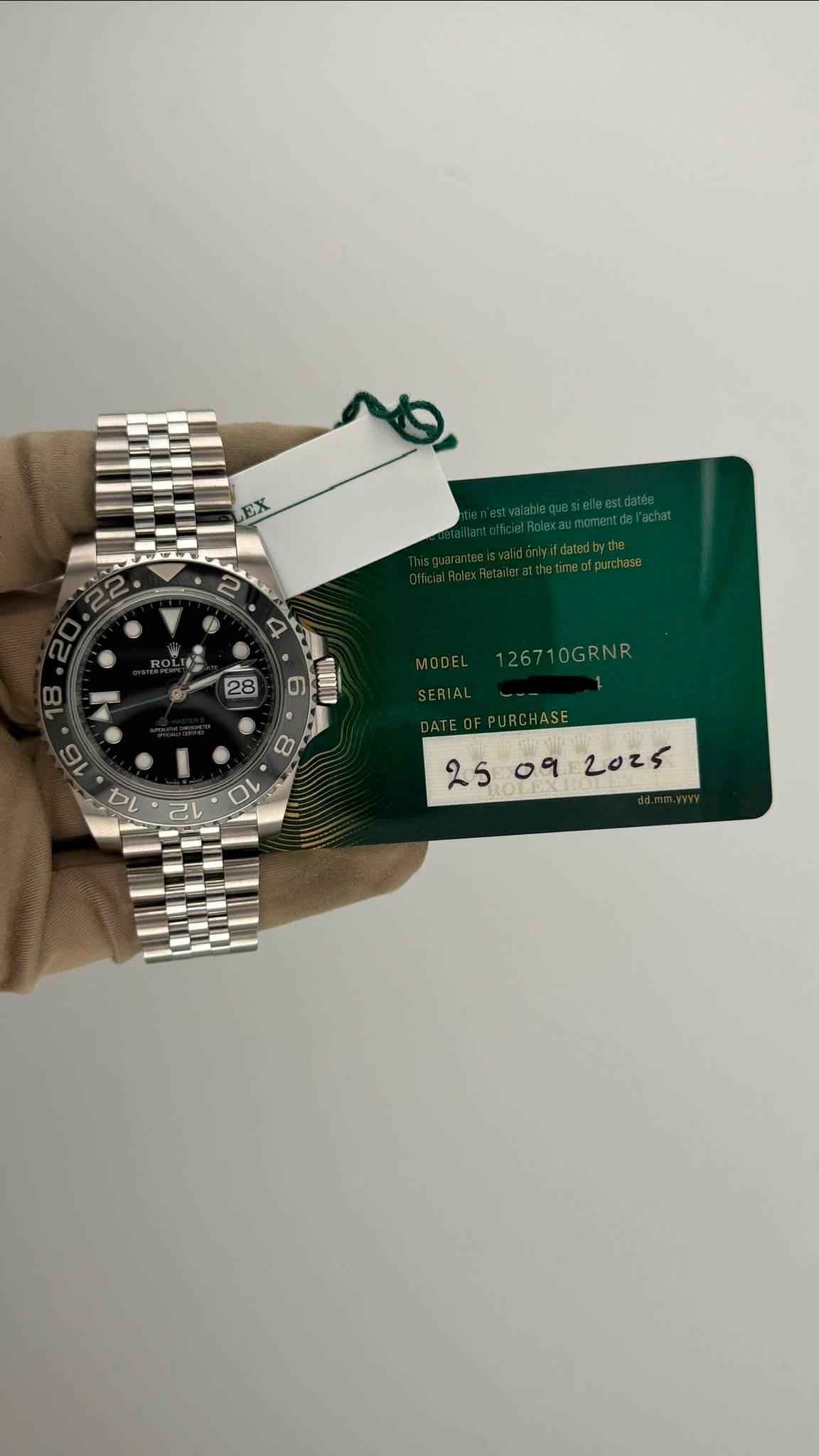 May be an image of wrist watch and text that says 'ו EX 28 6 126710GRNR 식 十 ٥٩ 2025'