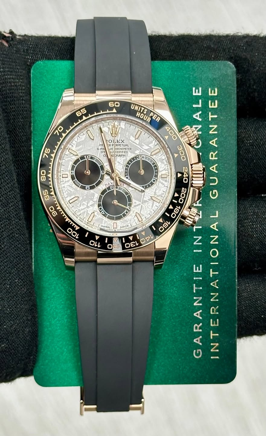May be an image of wrist watch and text that says '60 65 70 LEX PRPEIUAL RPETUAL 75 0 S () ٥ ν I 40 Q UNITS HOUR PER ALE NALGUARANTEE 400 00E コャレ า GARANTIE GARANTIEINTK…