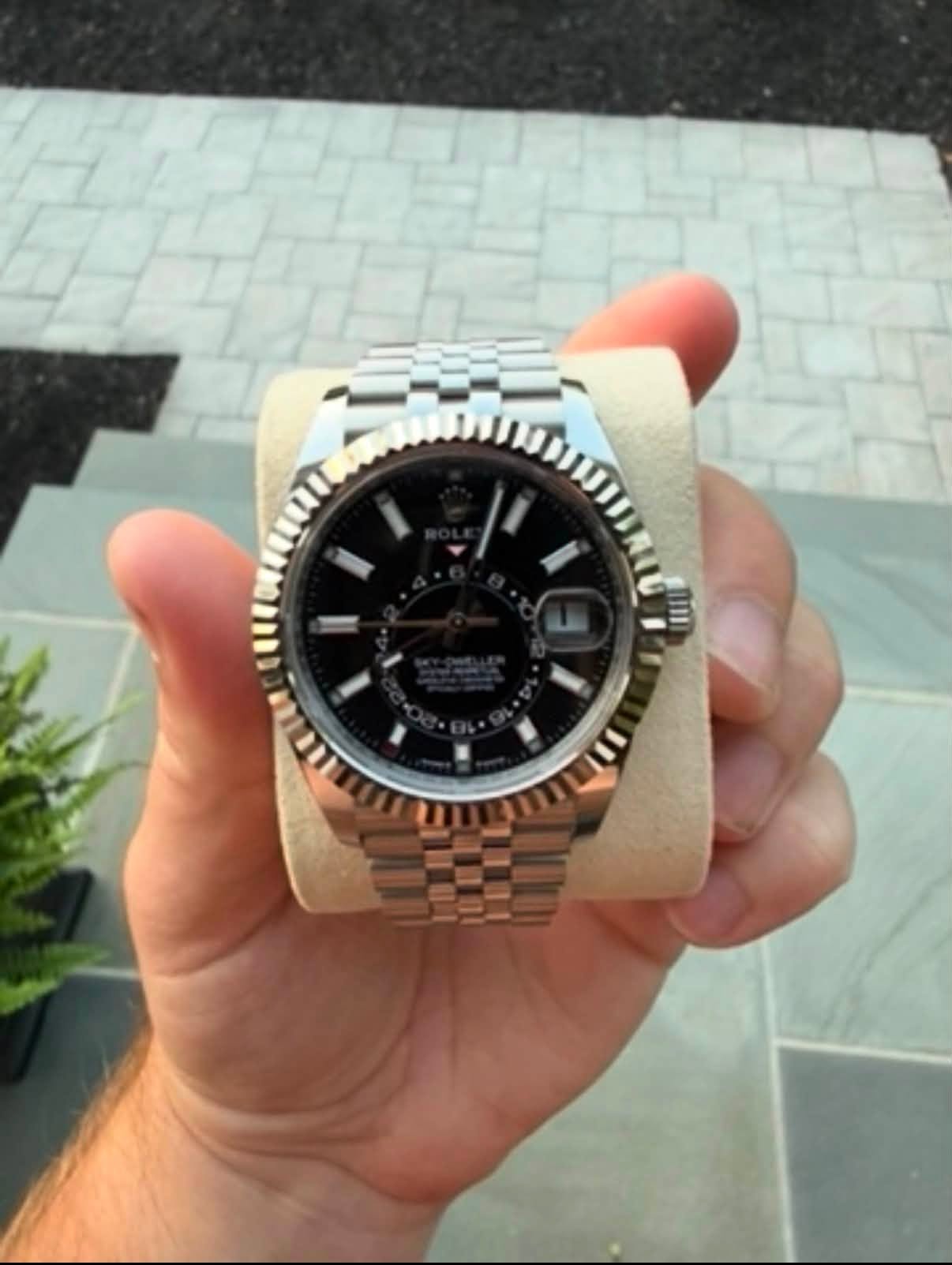 May be an image of wrist watch and text