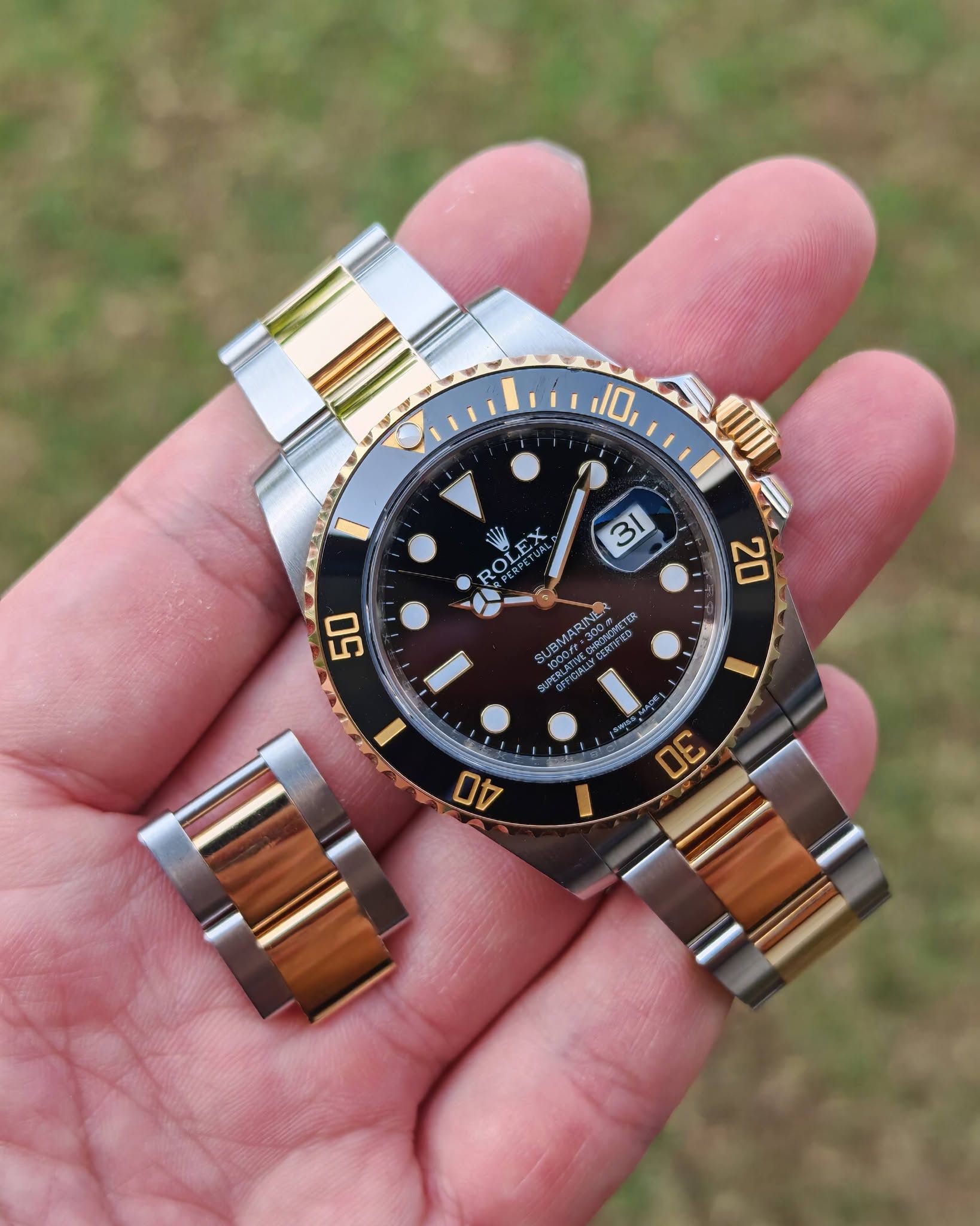 May be an image of wrist watch and text