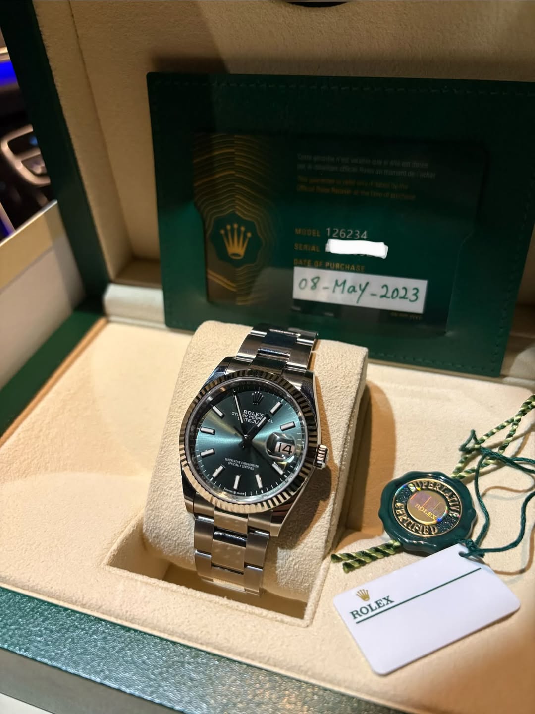 May be an image of wrist watch and text