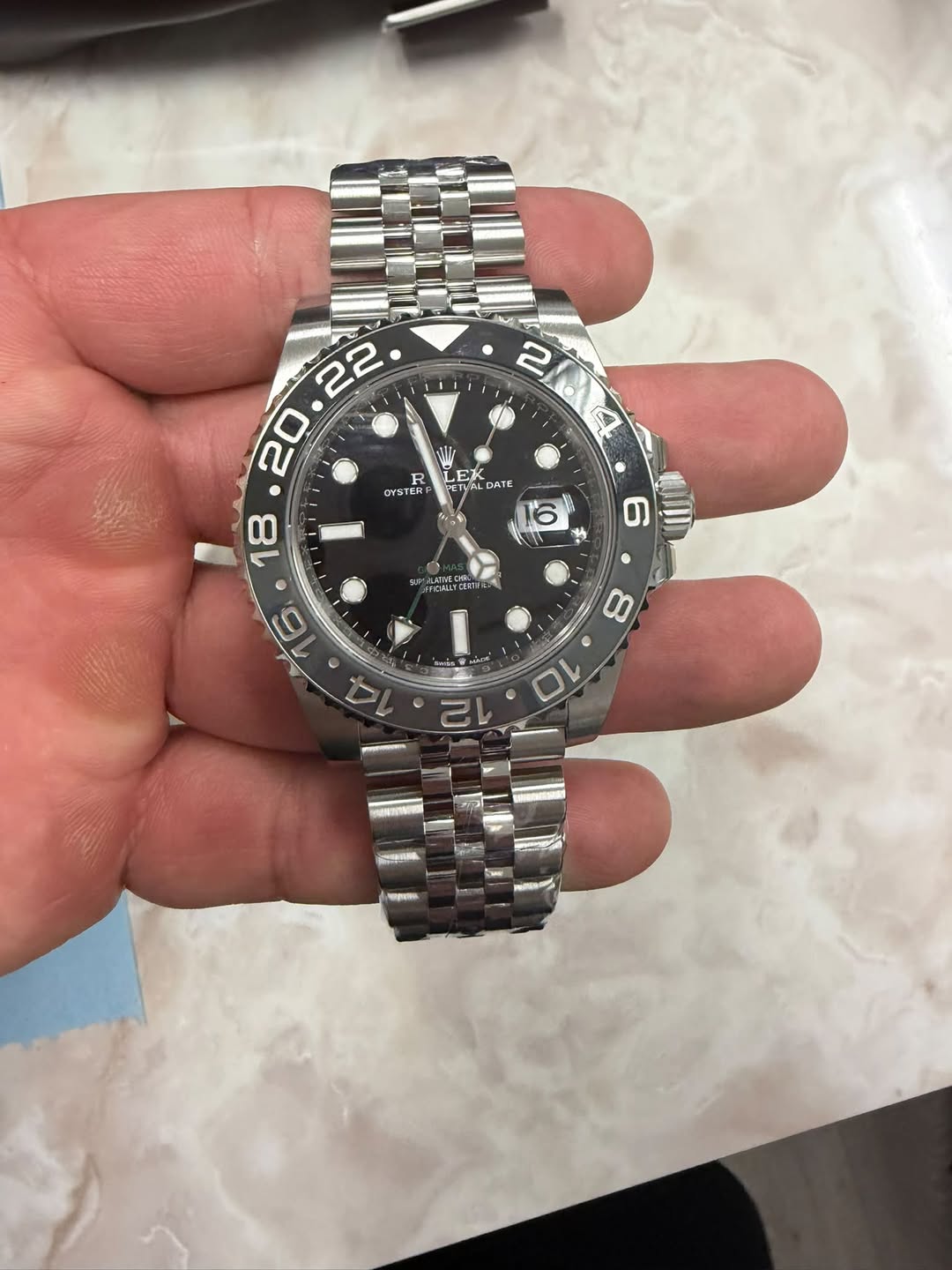May be an image of wrist watch and text
