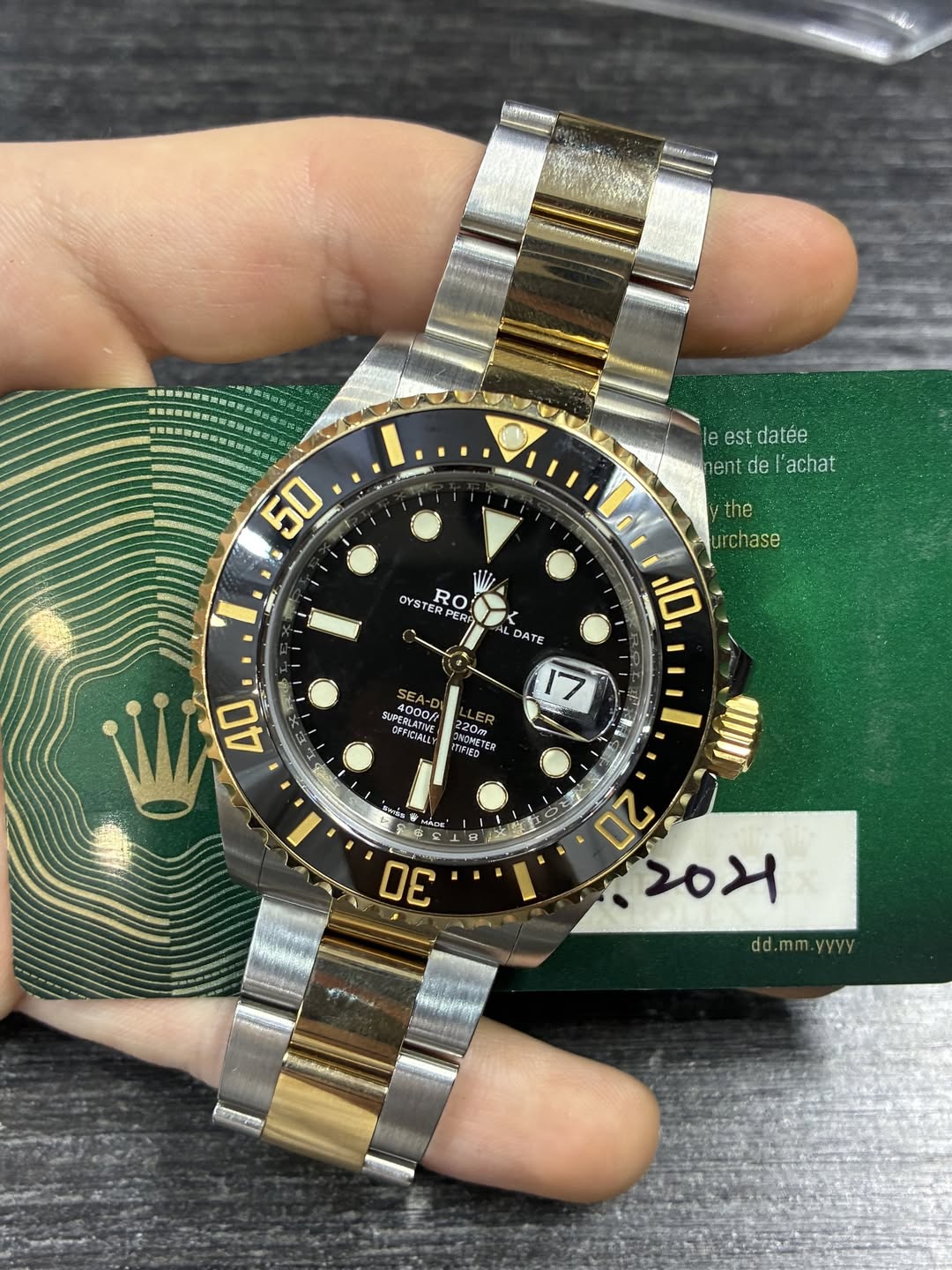 May be an image of wrist watch and text