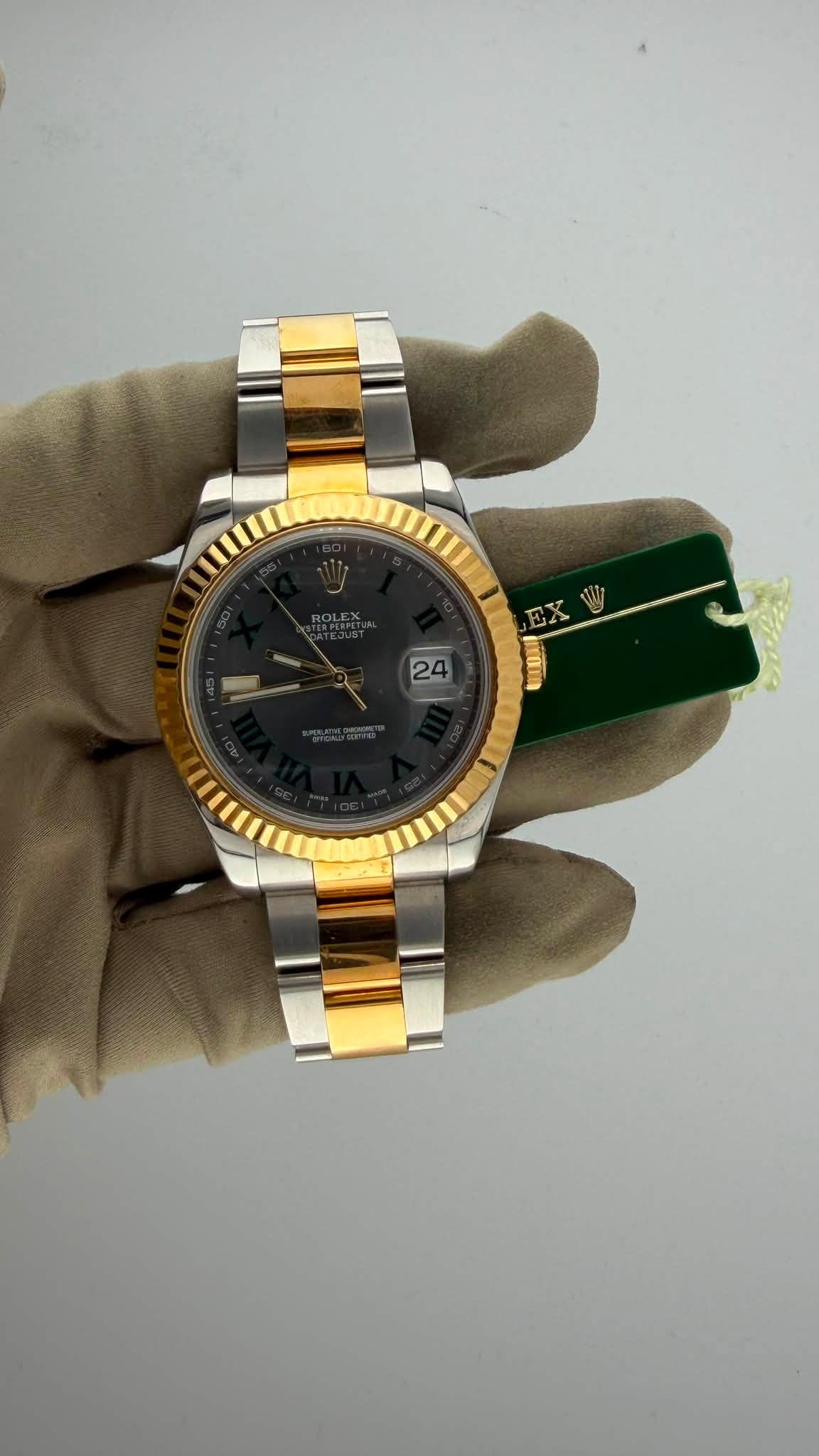May be an image of wrist watch and text
