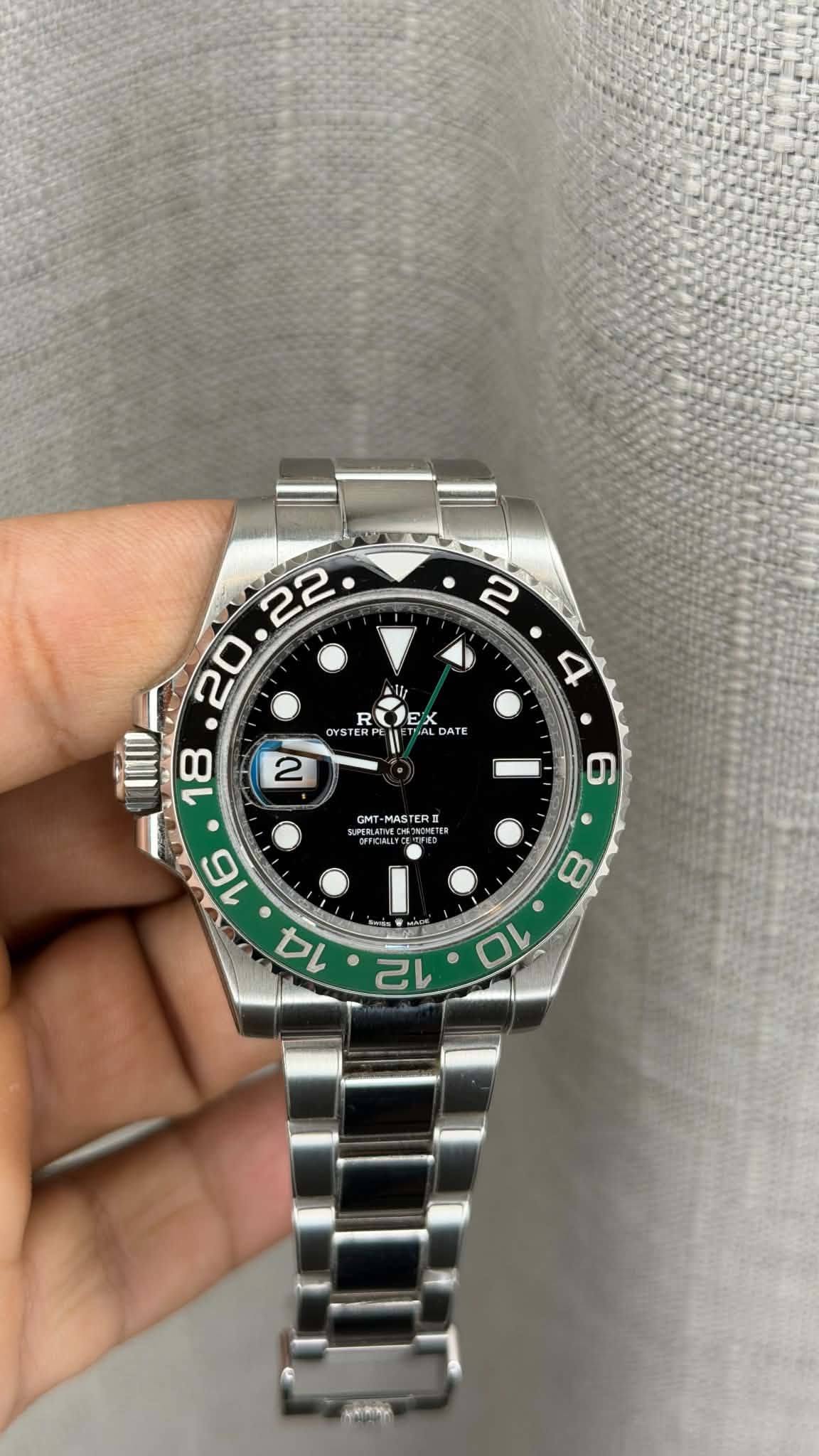 May be an image of wrist watch and text