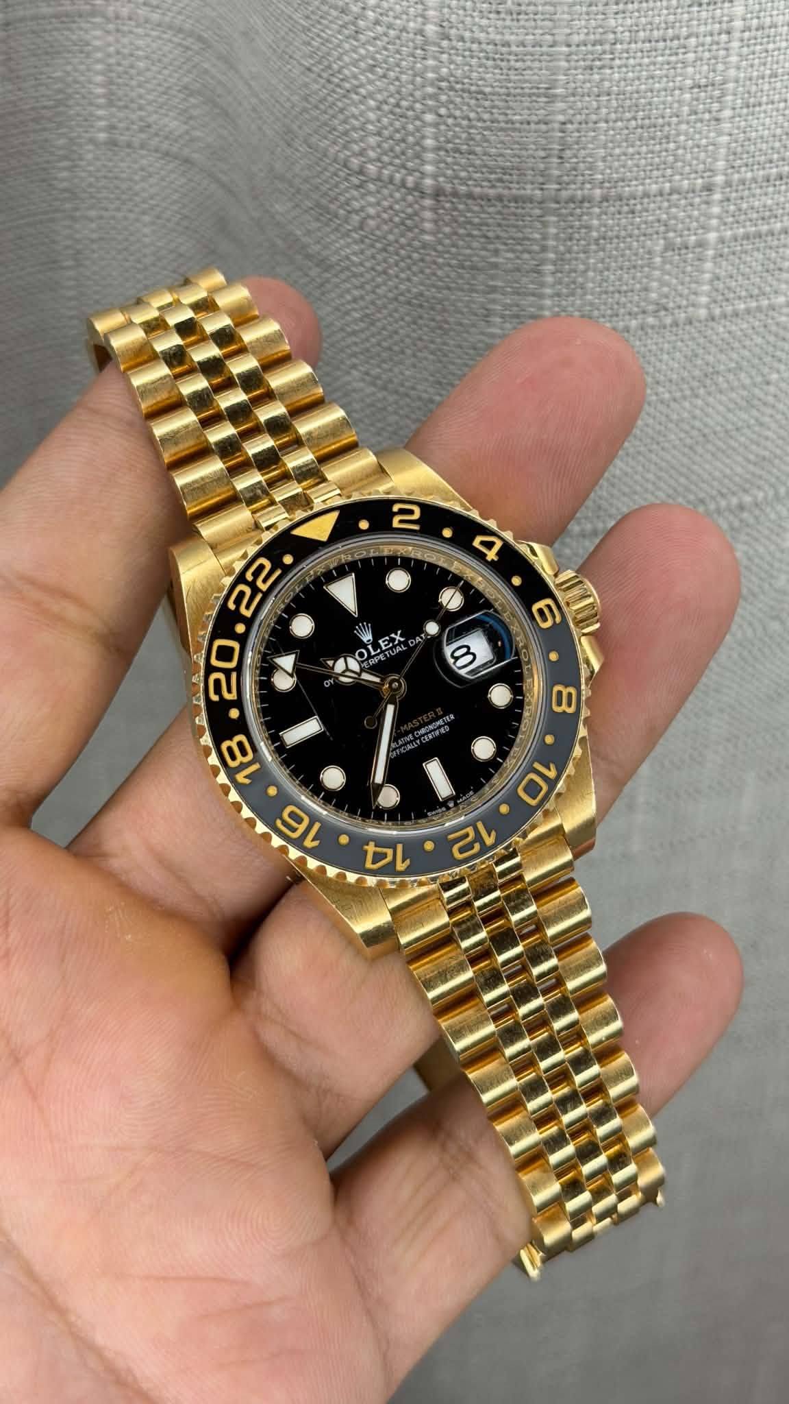 May be an image of wrist watch and text