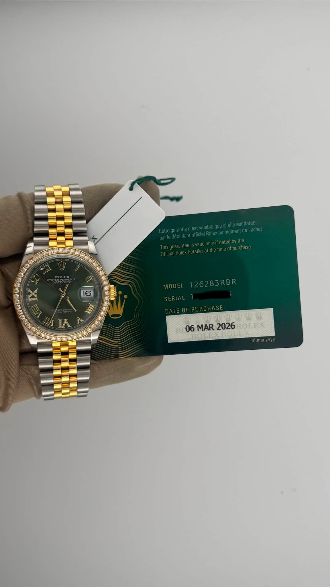 May be an image of wrist watch and text that says 'IX 6 HOF IOL সো AAT IA 06 06MAR2026 MAR2026 MAR 2026 OLEX'