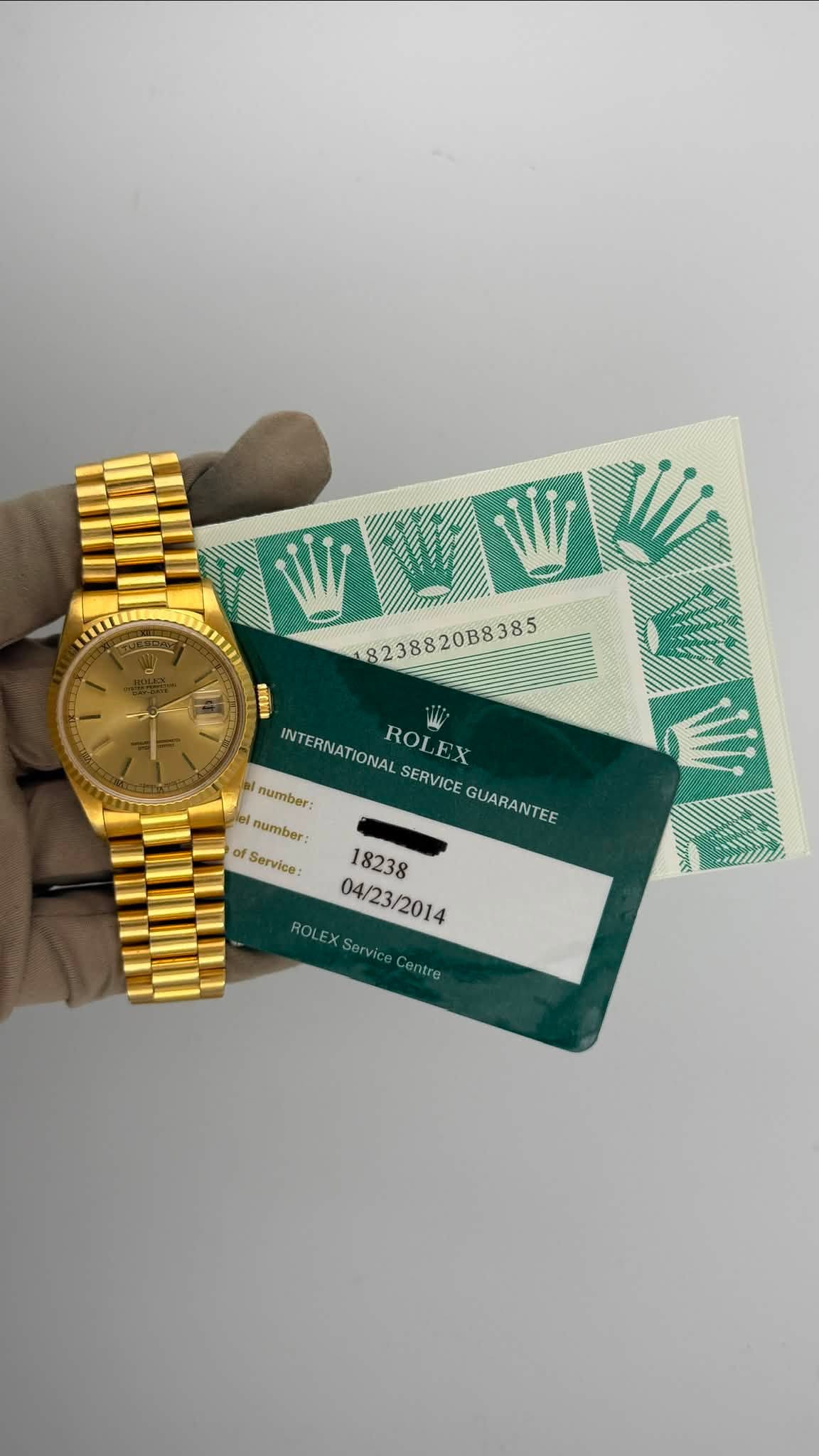 May be an image of wrist watch, money and text that says '18238820B8385 8238820B8385 EENIN INTERNATIONAL ROLEX number: SERVICE GUARANTEE number of Service: LIIms 18238 04/23/2014…