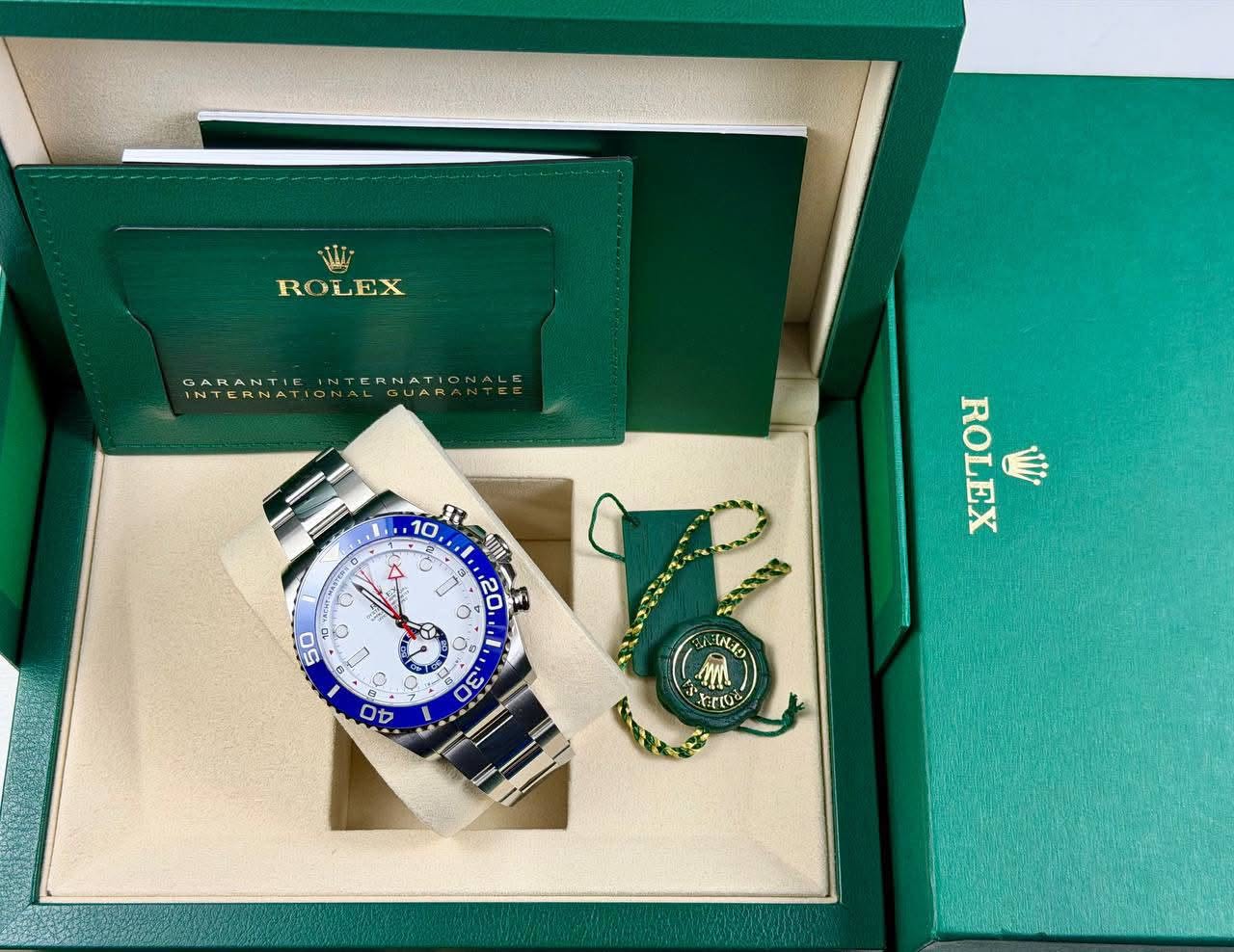 May be an image of wrist watch and text that says 'ROLEX GARANTIE IN NTERNA CATL QN 4 र 艺 10. 理 mii 7 7 a 20 O O y ) 모 0 ば AK A S 50 ROLEX W 40 ন M INI A 0'