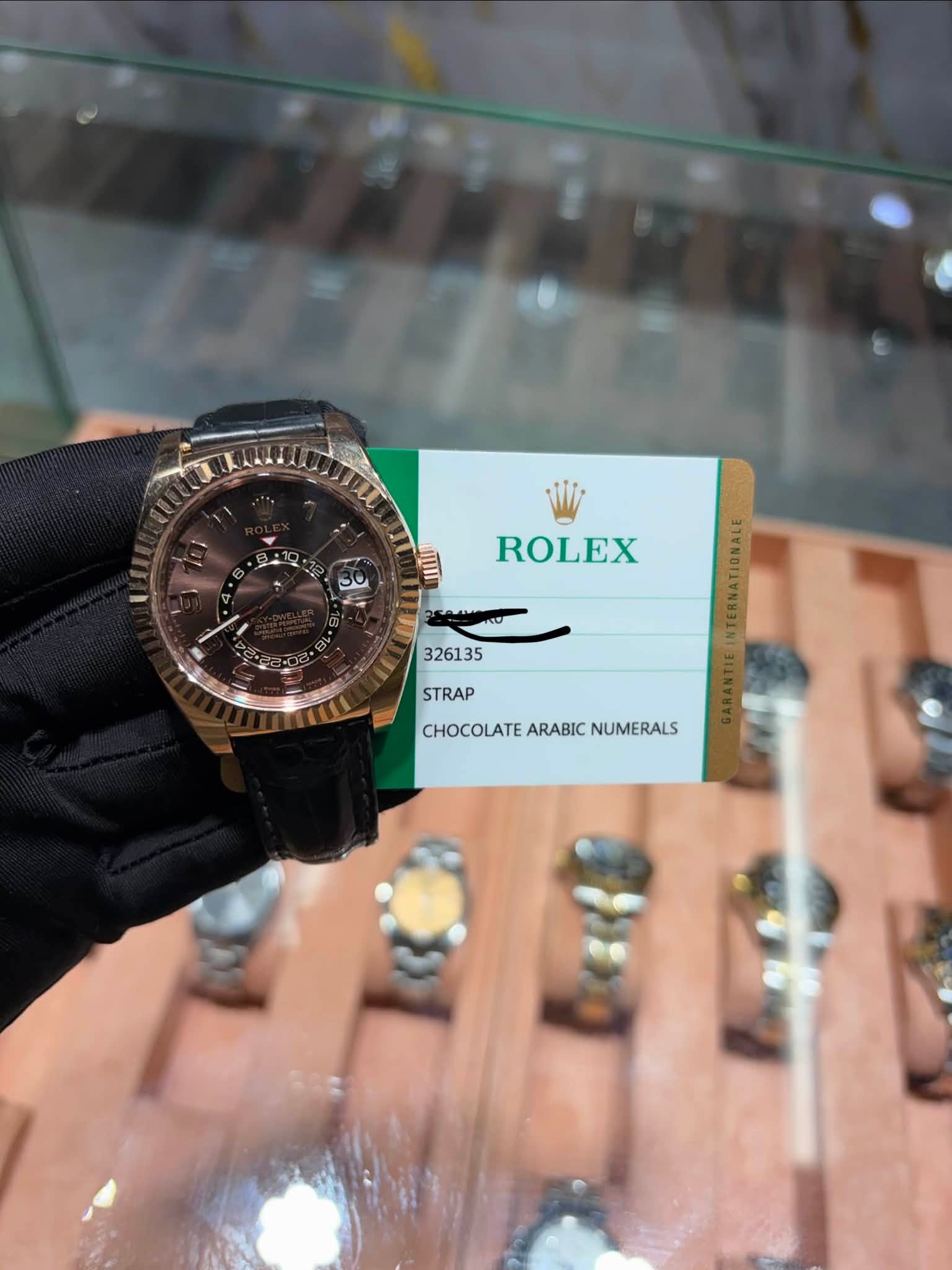 May be an image of wrist watch and text that says 'ROLEX 326135 STRAP CHOCOLATE ARABIC CHOCOLATEARABICNUMERALS NUMERALS'