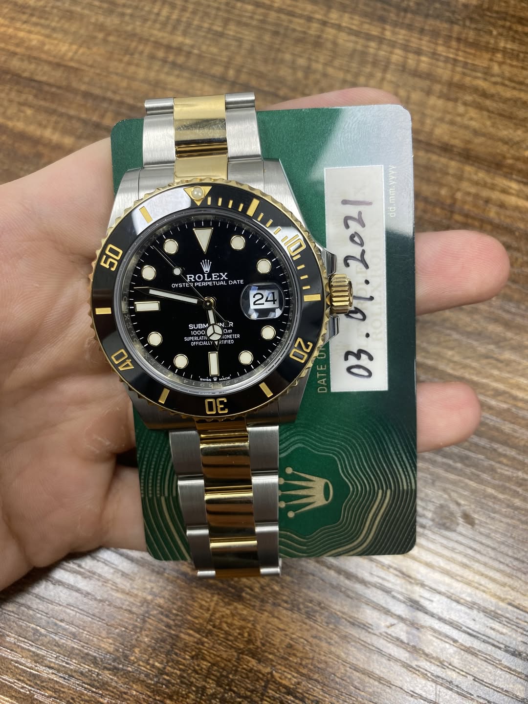 May be an image of wrist watch and text