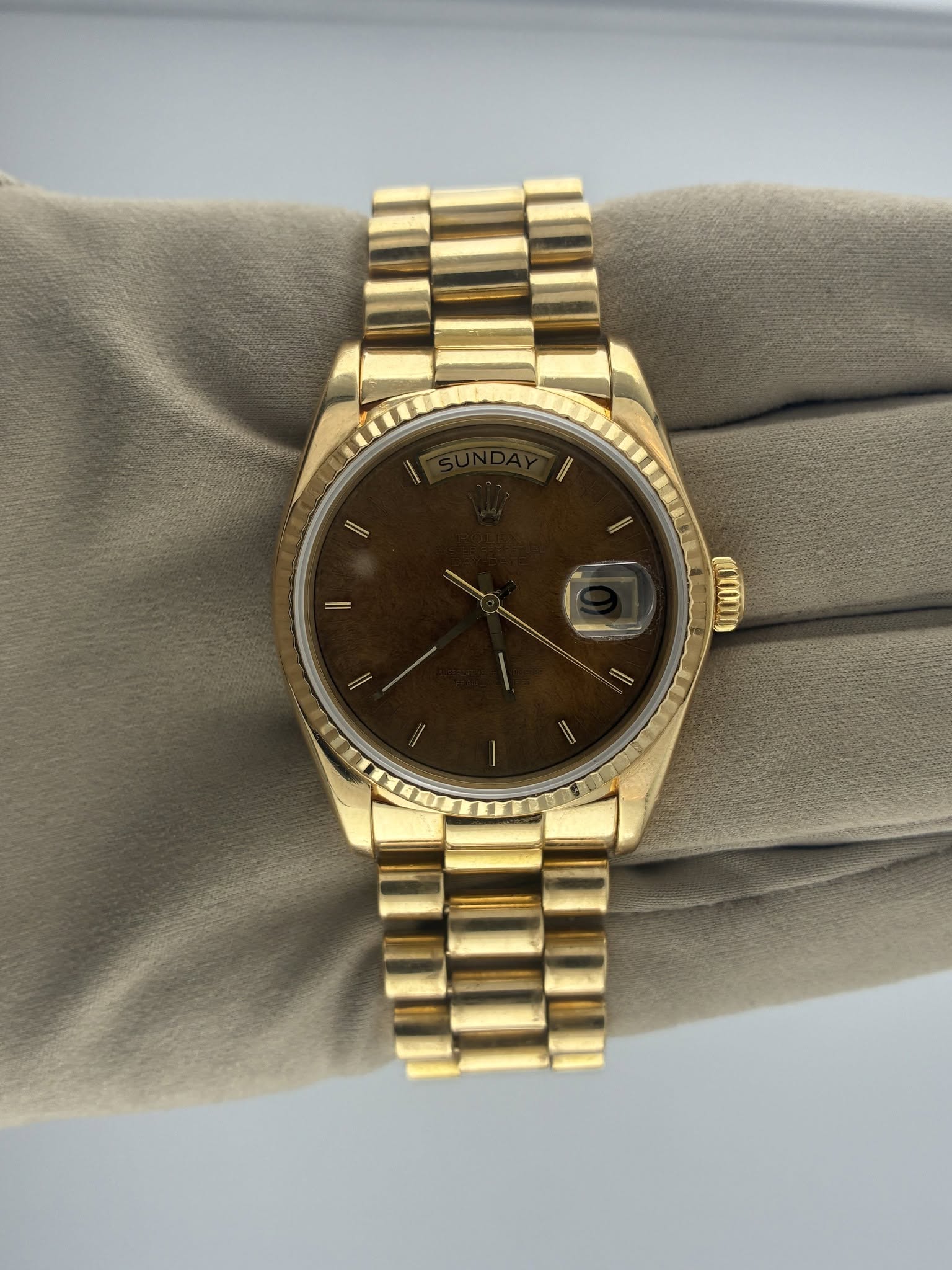 May be an image of wrist watch and text